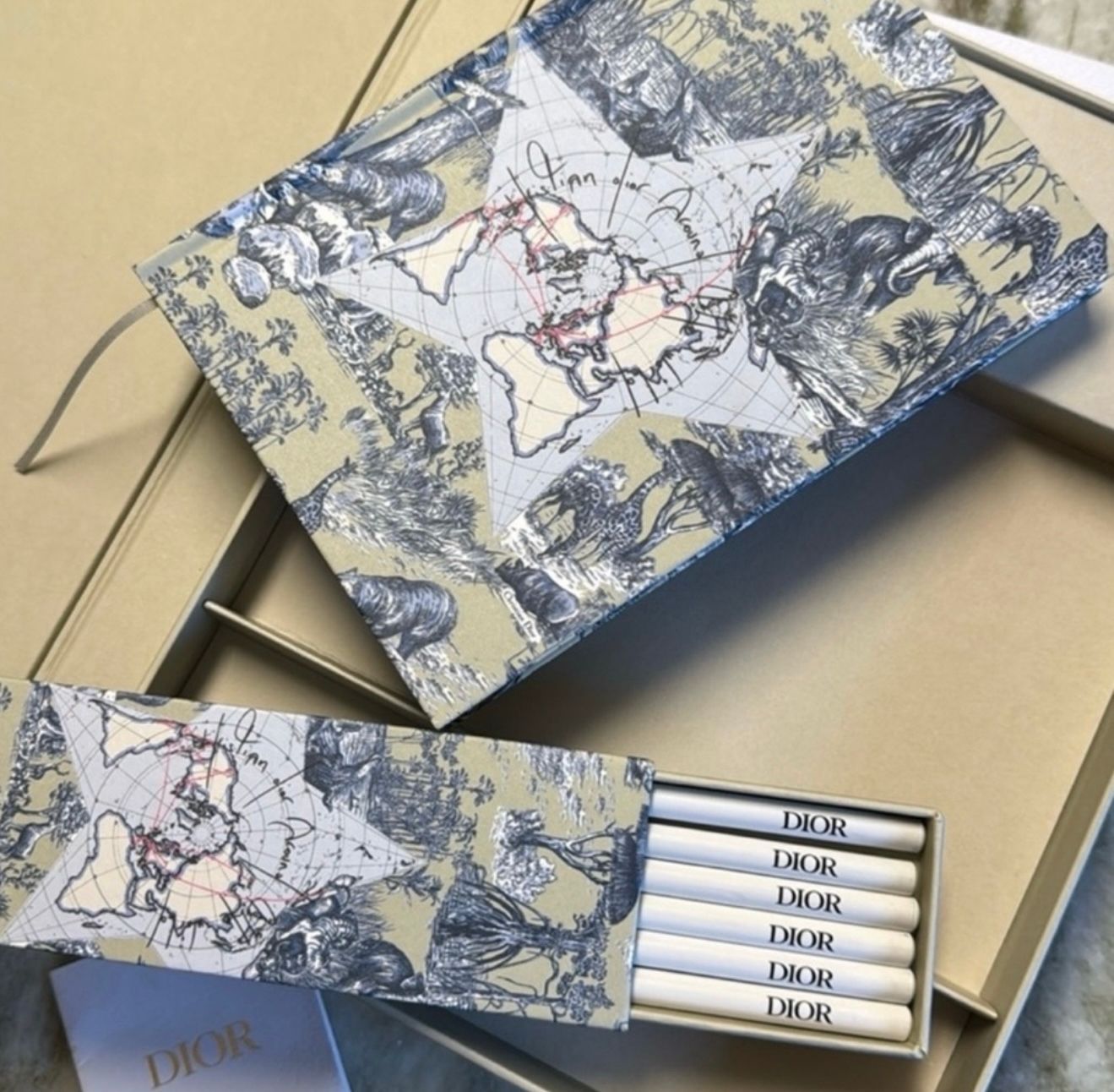 DIOR AROUND THE WORLD NOTE BOOK AND PENCIL SET · Whatnot: Shop