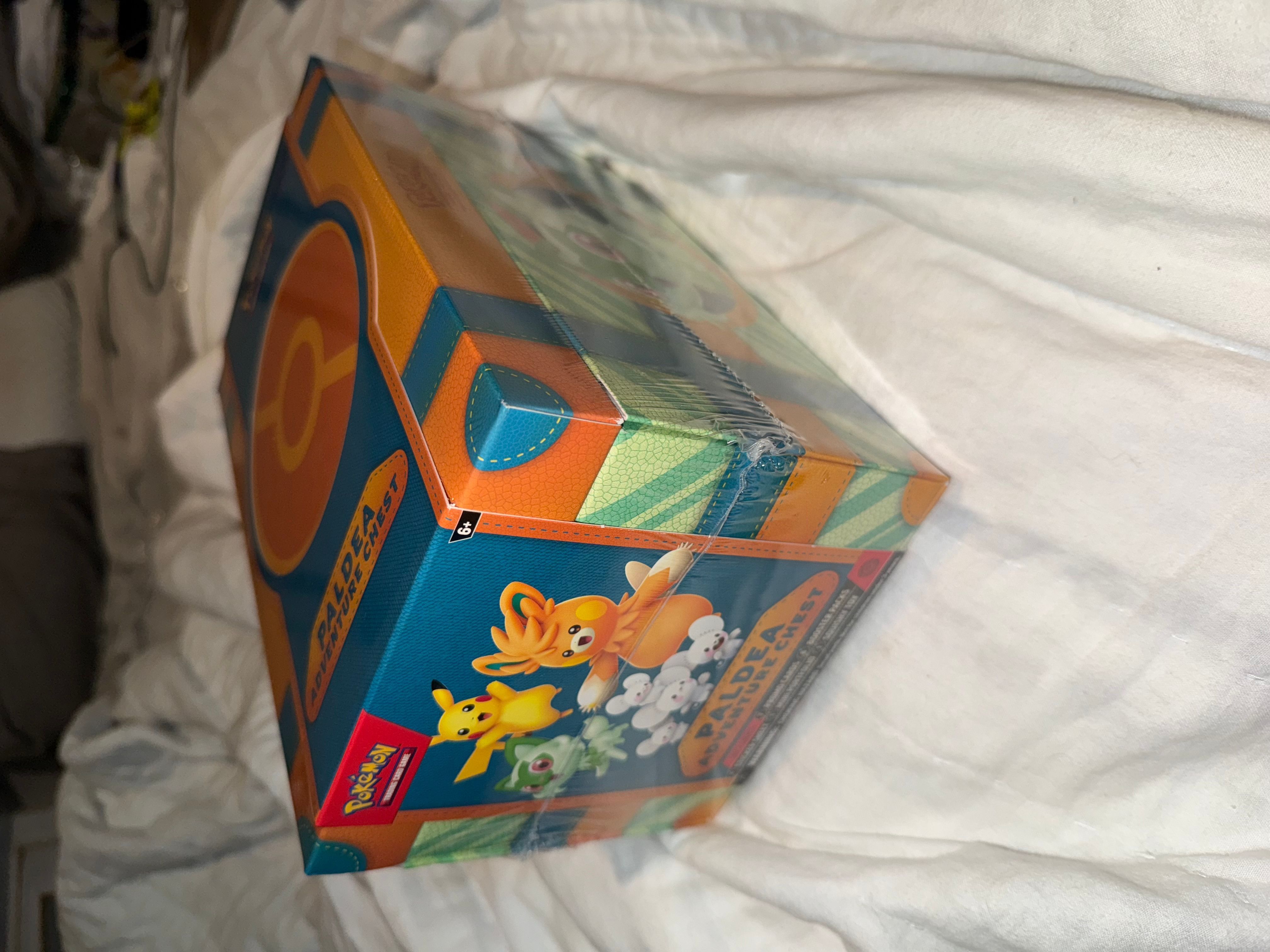 Pokemon TCG: Paldea Adventure Chest  Whatnot: Shop, Sell, Connect