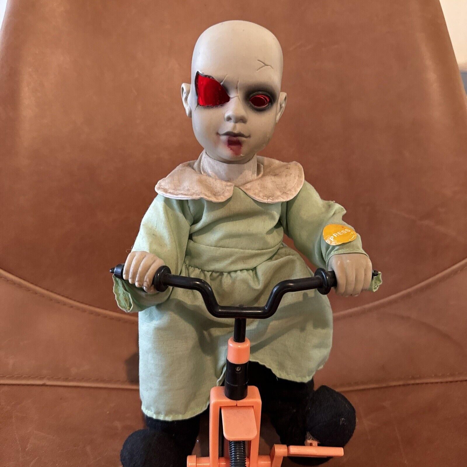 Scary doll on tricycle online