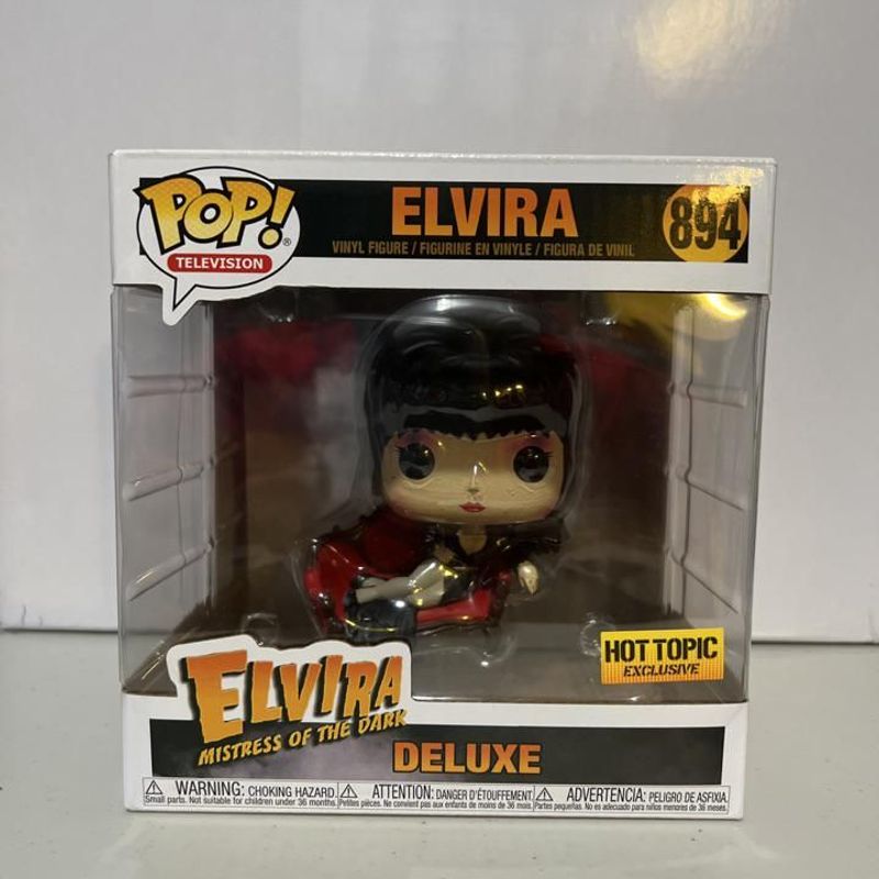 Elvira (on Red Sofa) (Deluxe)