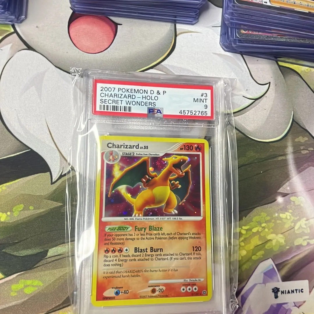 charizard pokemon card 2007 Graded: 3/132 Secret Wonders (2007) Holo Beckett 9 perfect for serious collectors and enthusiasts of the Pokmon Trading Card Game.  A HUGE grail on