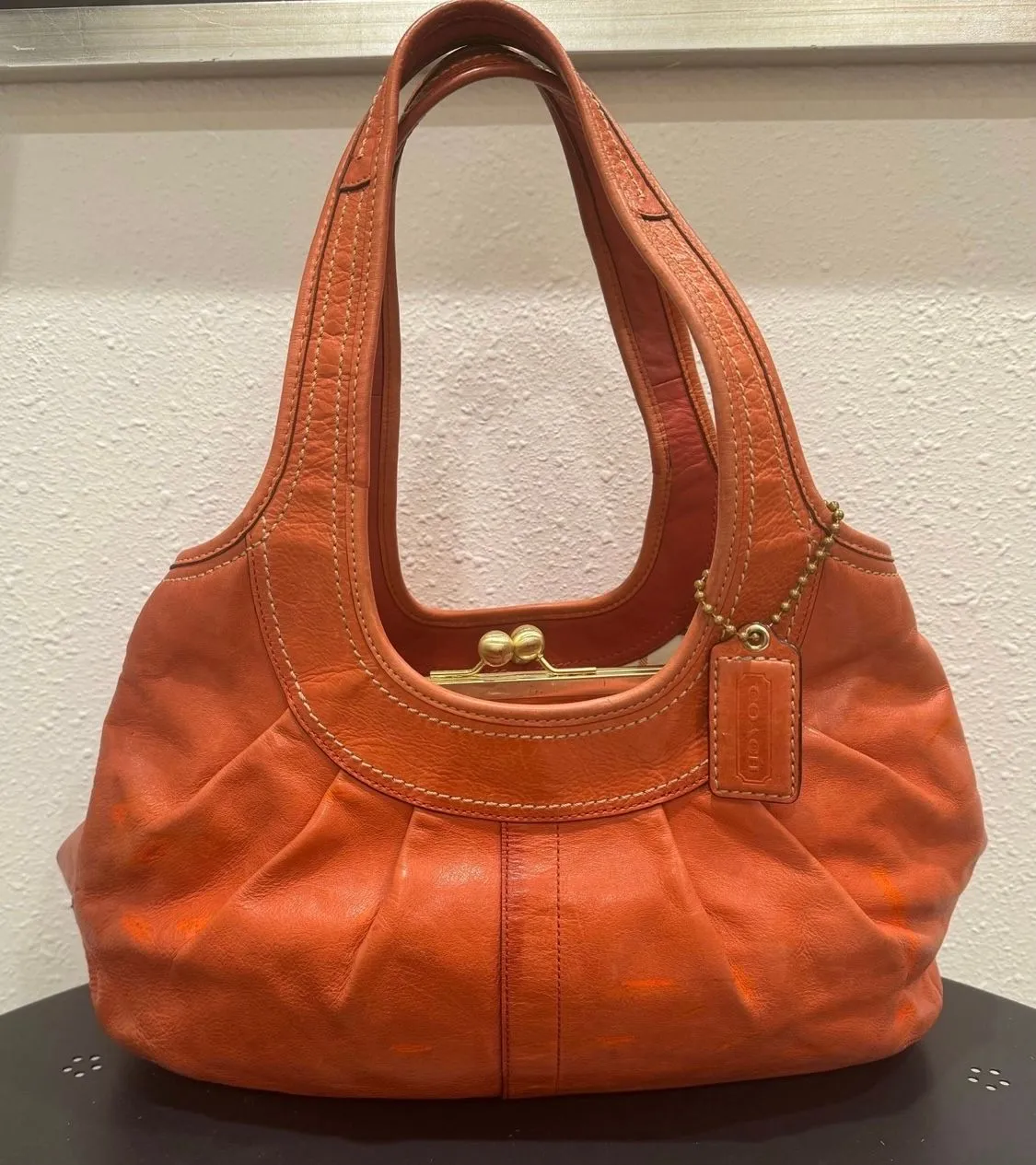 Coach offers Ergo Orange Leather Pleated Hobo