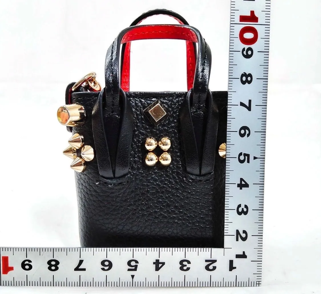 1982: Christian Louboutin Cabata mini studded leather tote AirPods