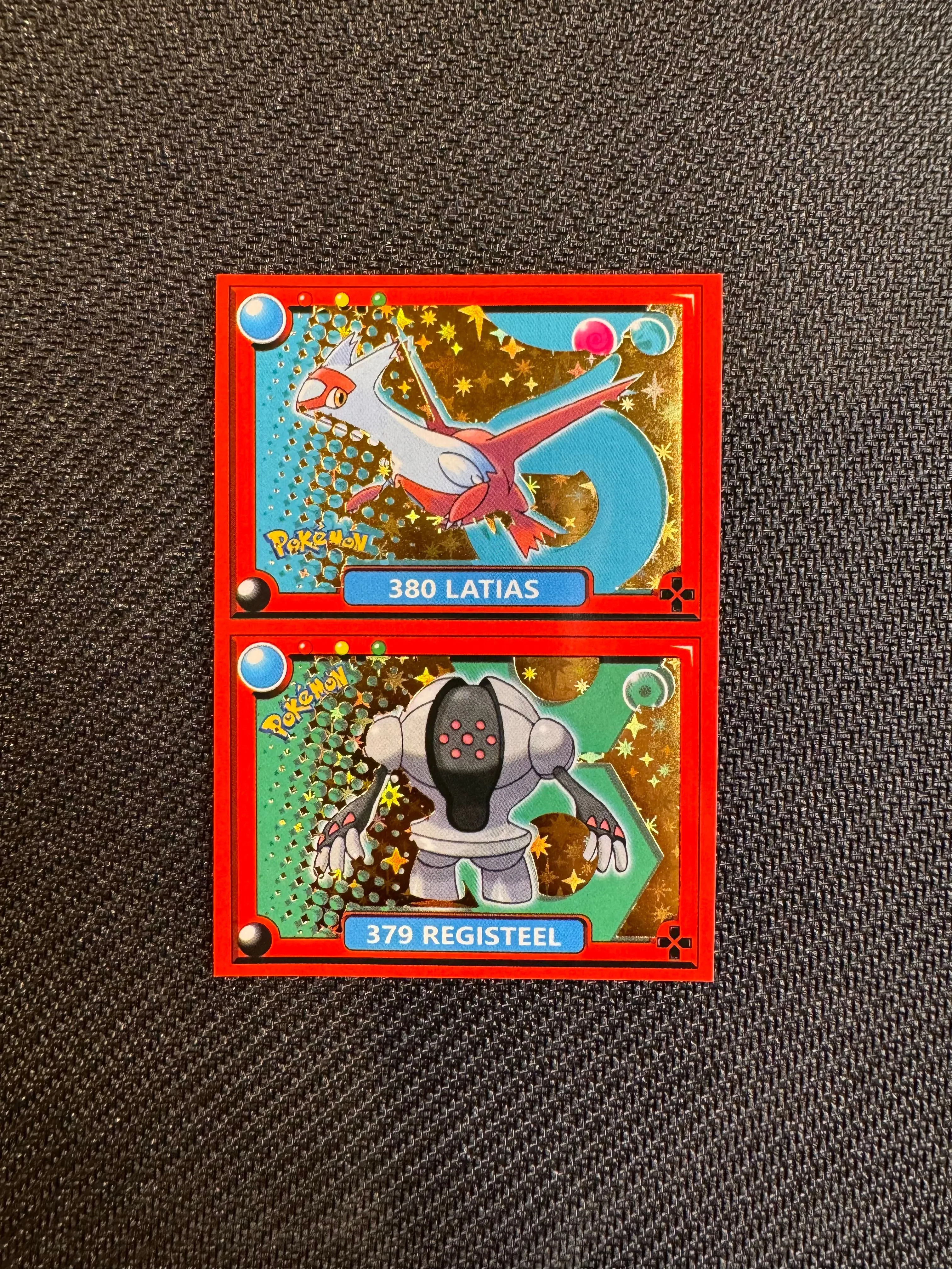 Product image for Pokédex Single (red) - Gold Foil Latias & Registeel Sticker