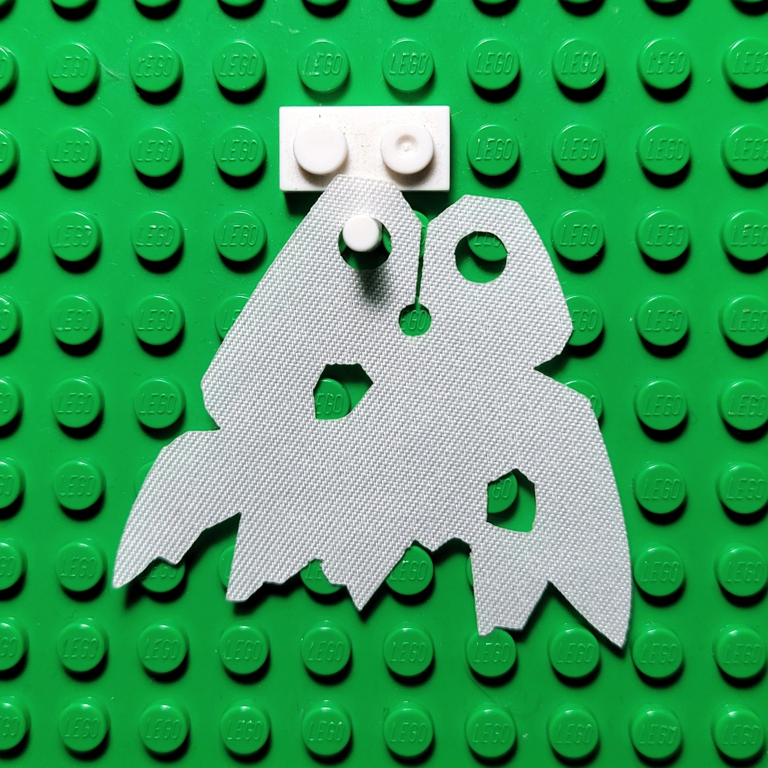 Product image for Cape (white rip & holes)