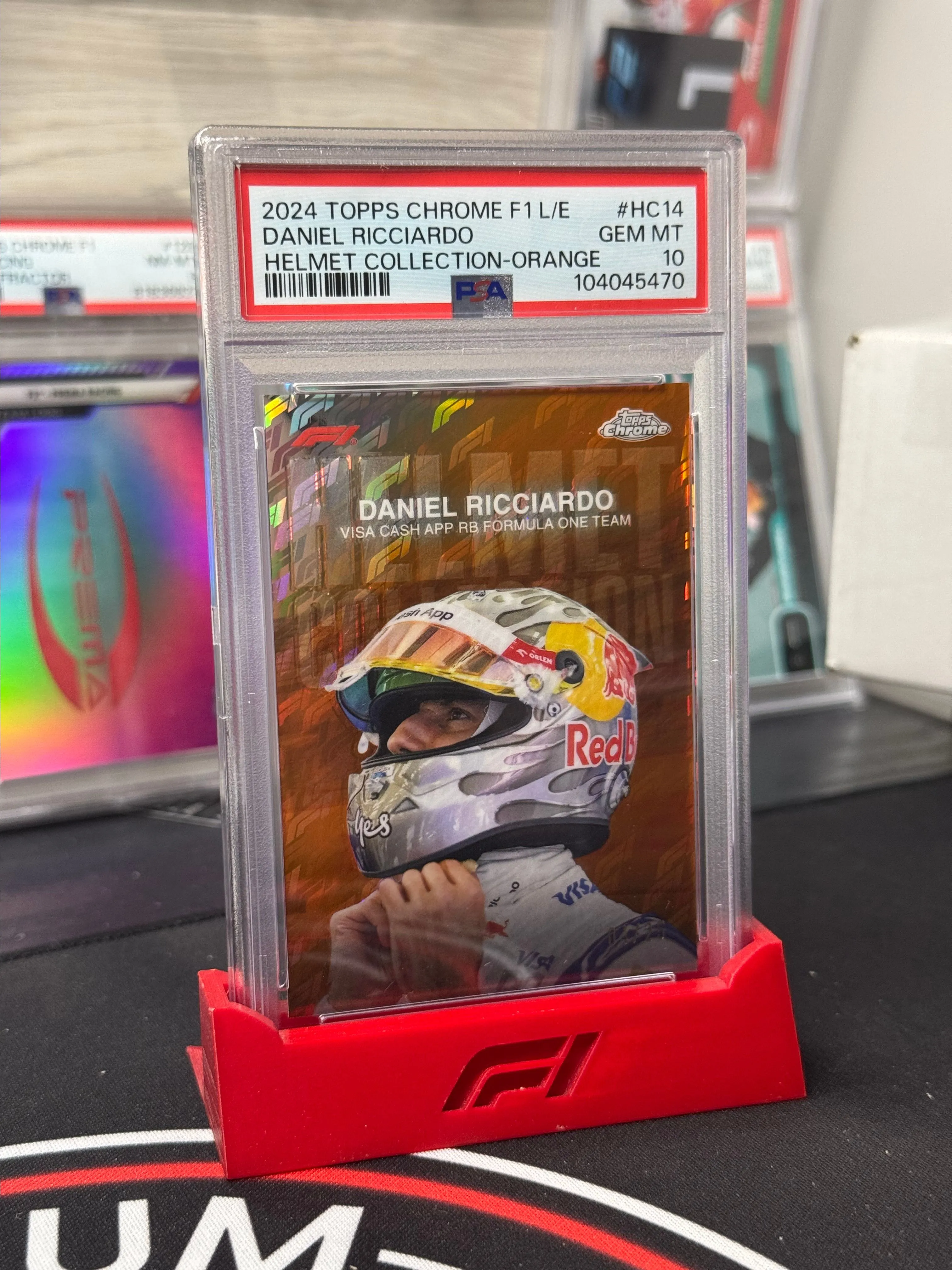 Product image for 2024 Topps Chrome Formula 1 Logofractor - Daniel Ricciardo Orange Helmet /25 PSA 10