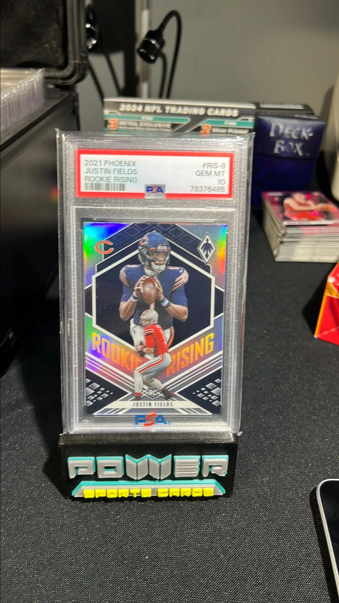 Product image for 2021 Panini Phoenix Rookie Rising Justin Fields RIS-8 Rookie Rising PSA GEM MT 10