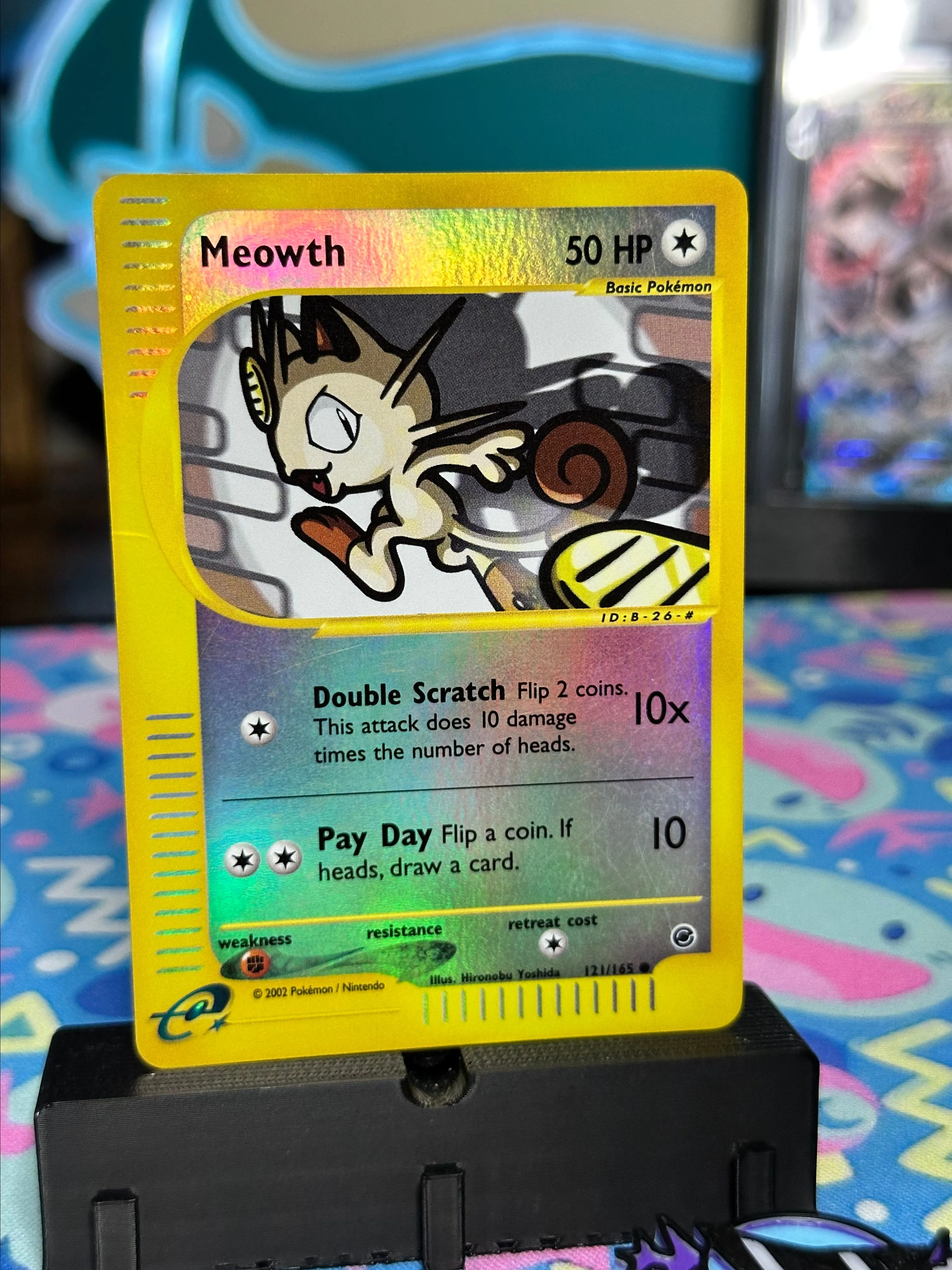 Product image for Meowth 121/165 rev holo
