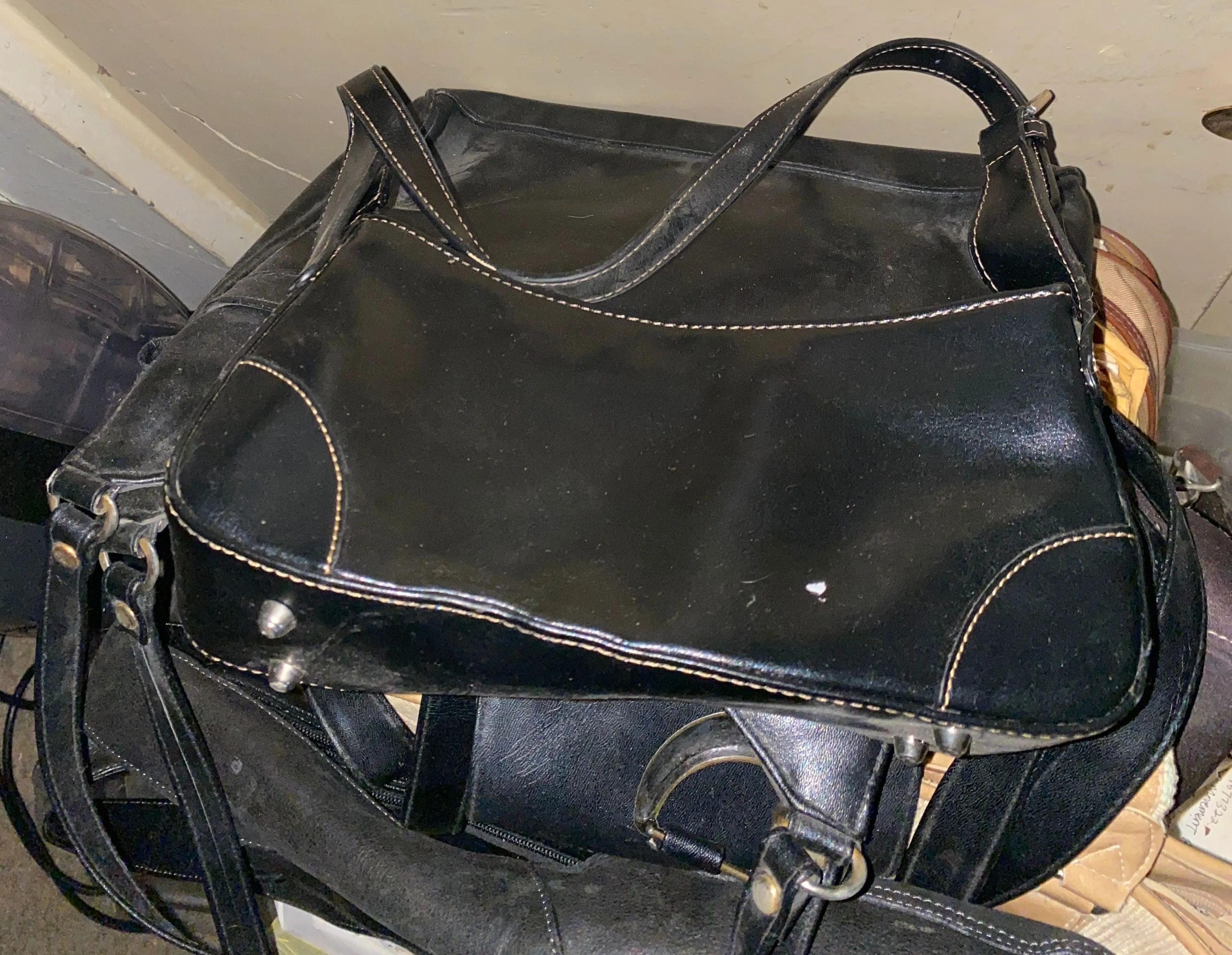 Product image for Sleek black tote bag with eye-catching contrast stitching. Perfect for everyday use.