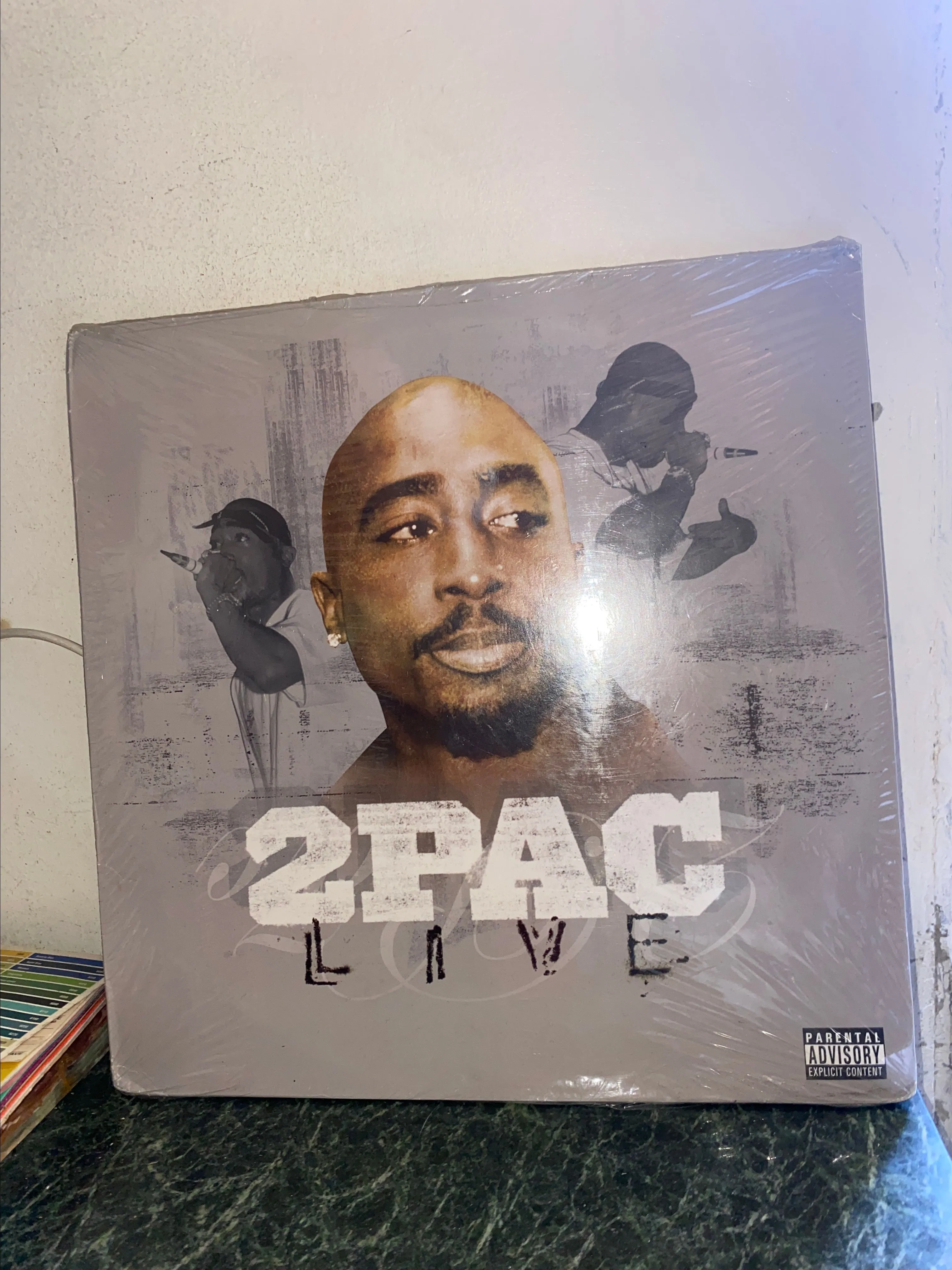 Product image for 2Pac - Live (2xLP, Comp) Media: Mint (M) Sleeve: Very Good (VG)  Comments: Still in shrink. A flap o