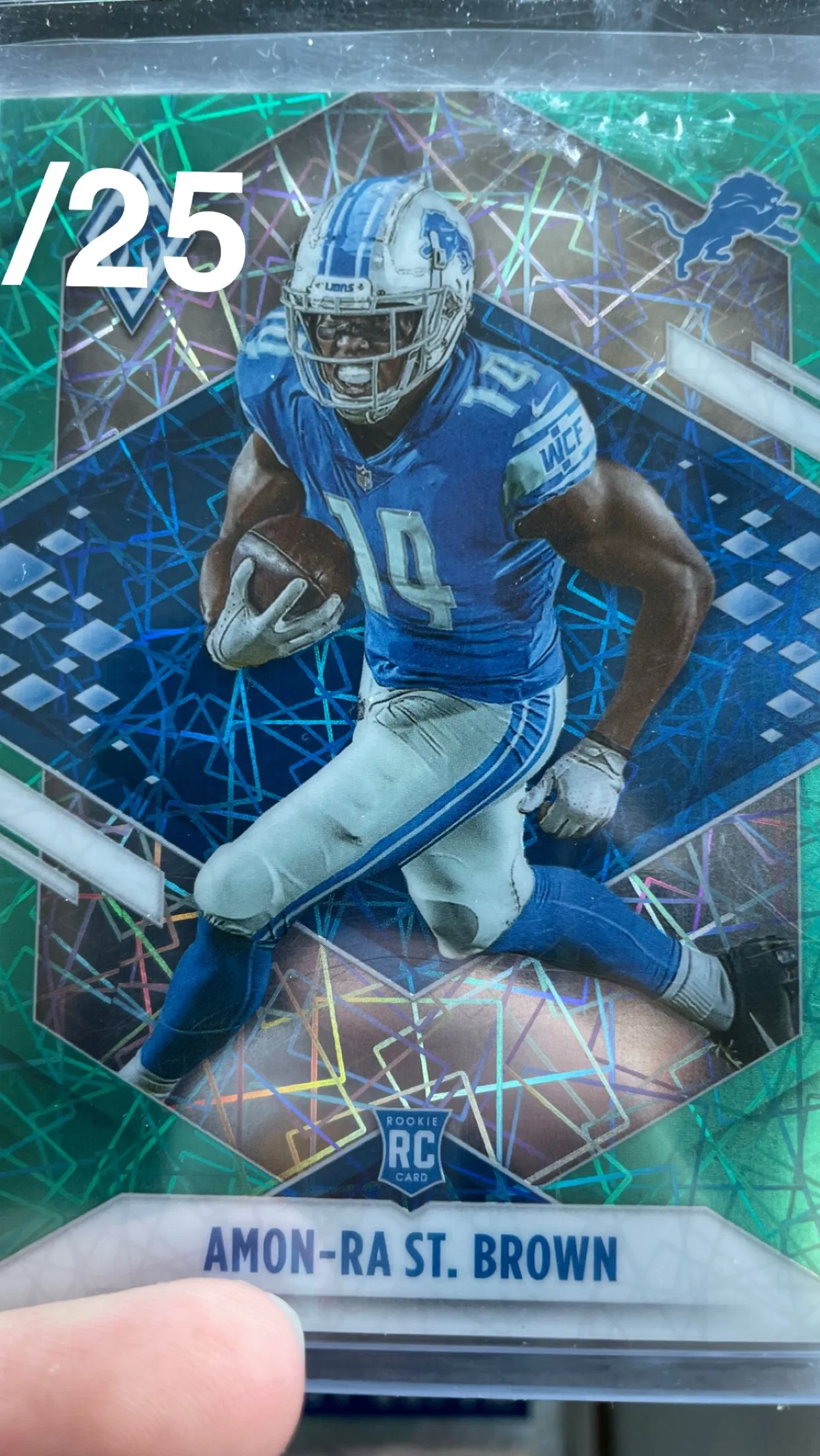 Product image for Amon Ra St. Brown Phoenix /25 Teal/green Velocity RC Rookie