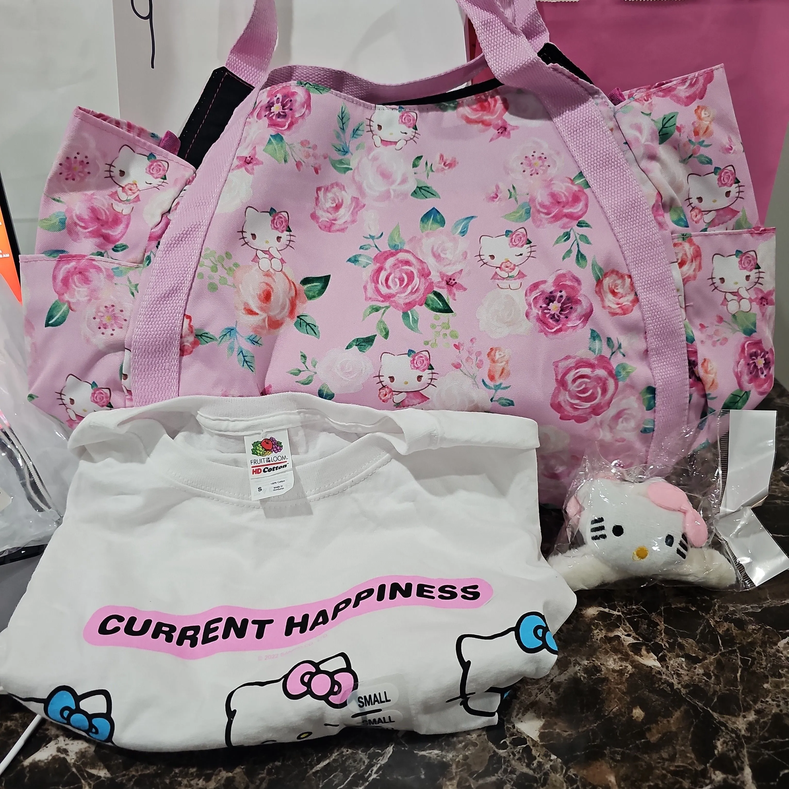 Product image for Hello kitty tote and shirt bundle.