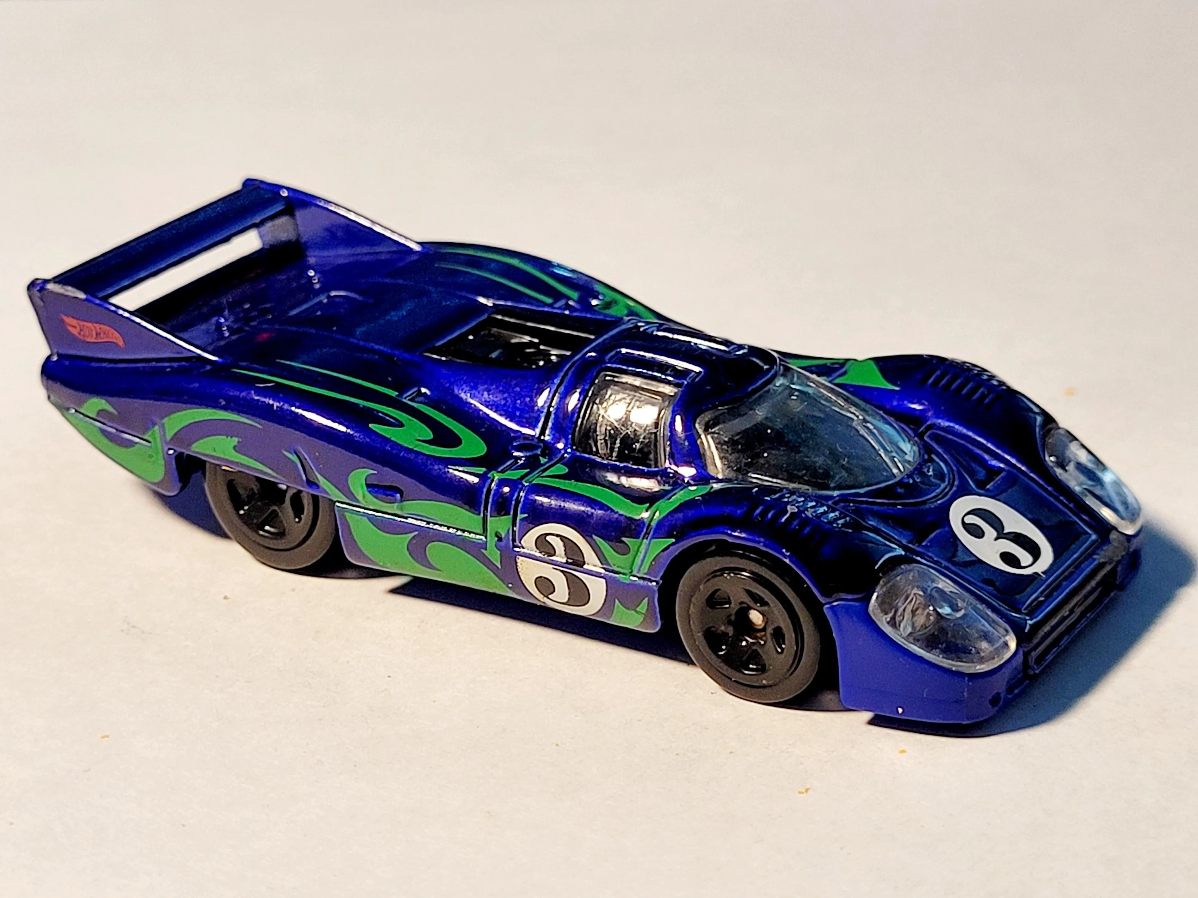 Product image for 2017 Hot Wheels Porsche 917 LH #3 Blue Diorama Model 1:64 Scale Die-Cast Car. The image shows a blue