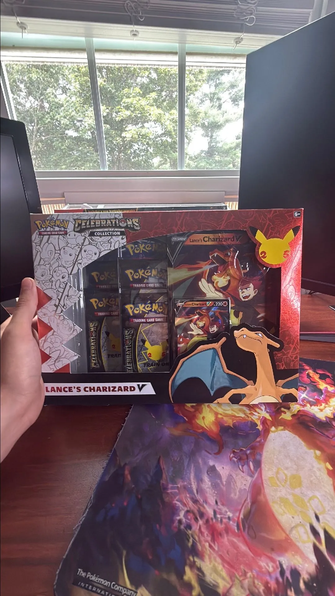 Product image for Lances charizard v celebrations box includes 1 evolving skies pack 1 fusion pack and 4 celebrations