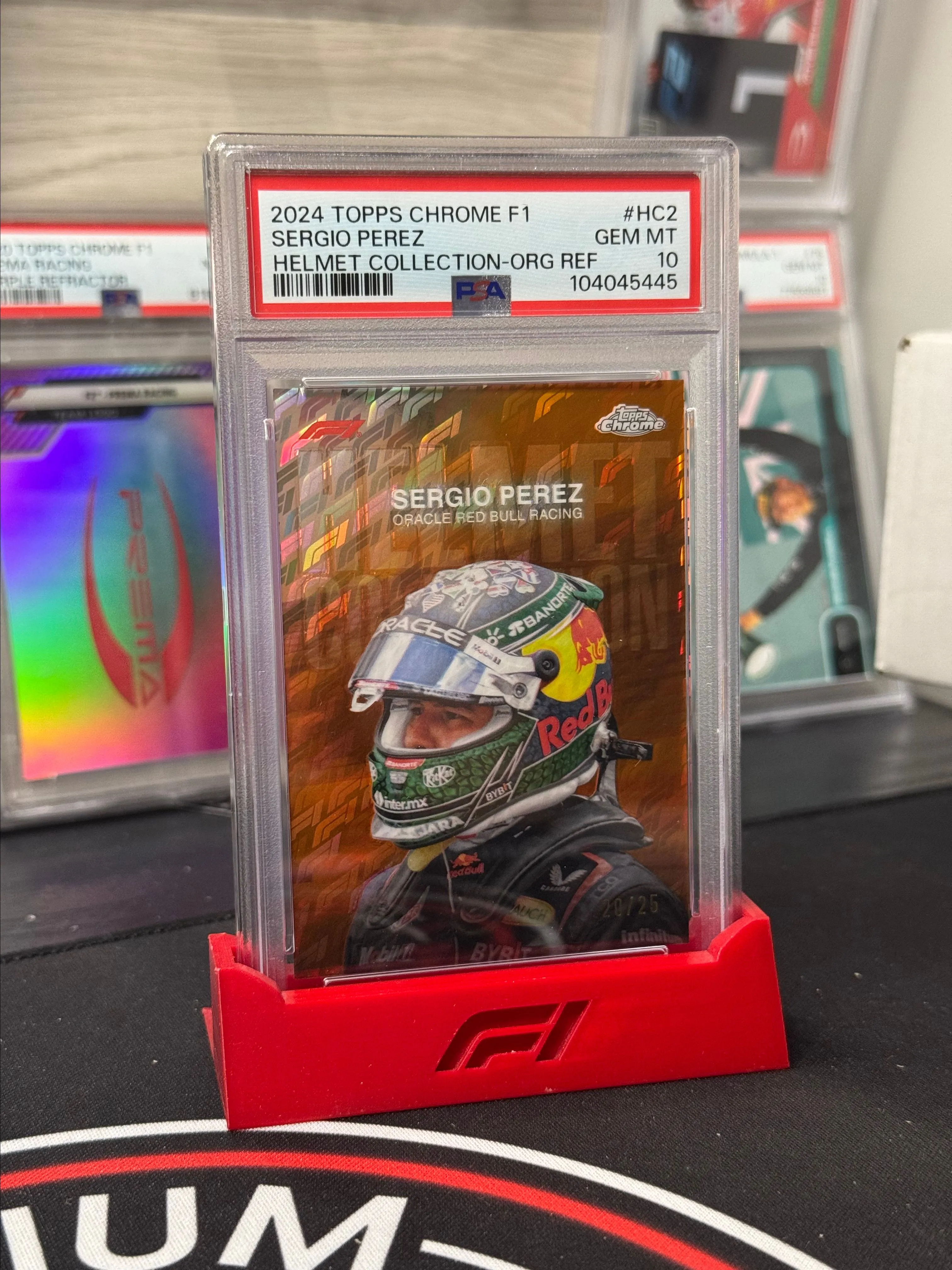 Product image for 2024 Topps Chrome Formula 1 Logofractor - Sergio Perez Orange Helmet /25 PSA 10