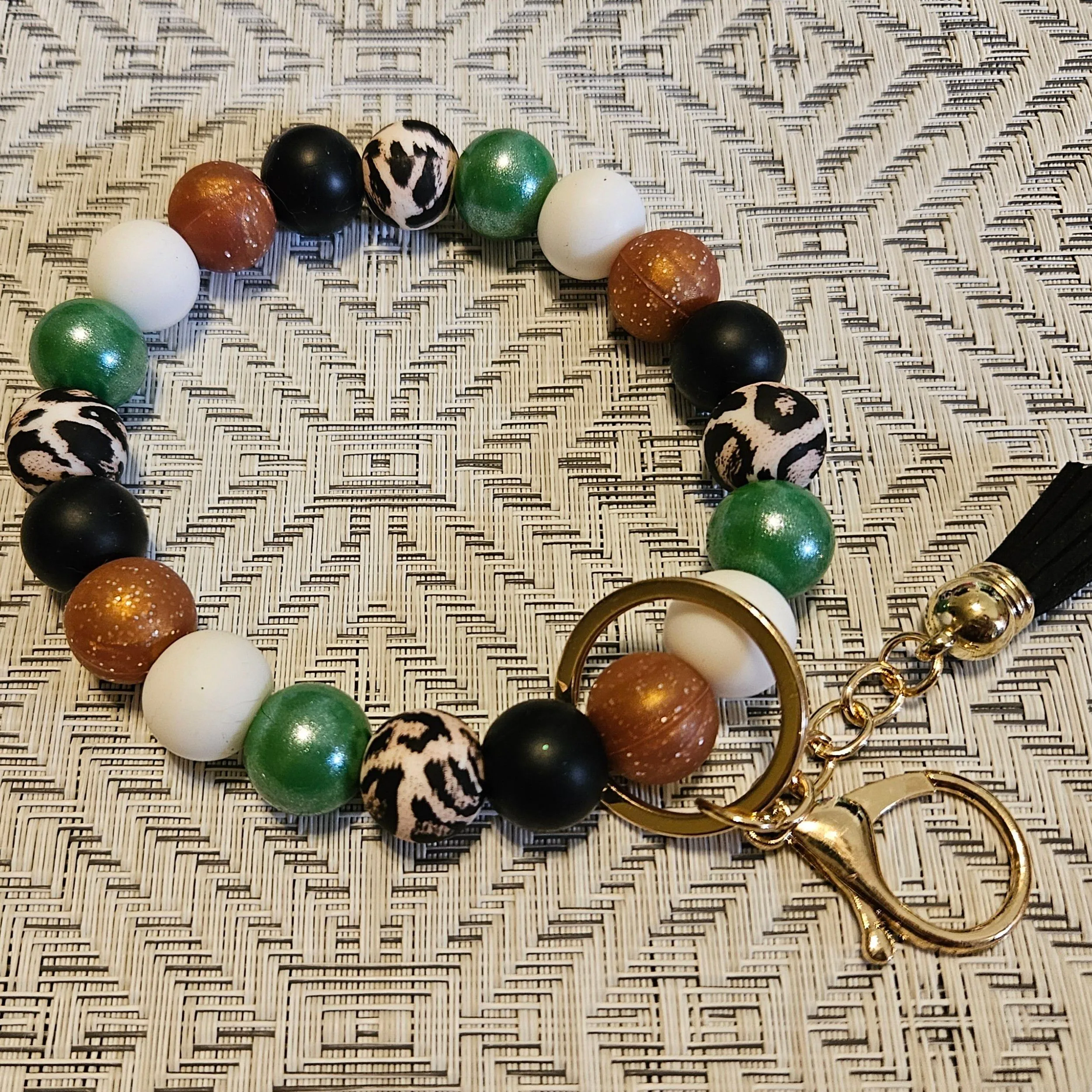 Product image for green & copper wristlet