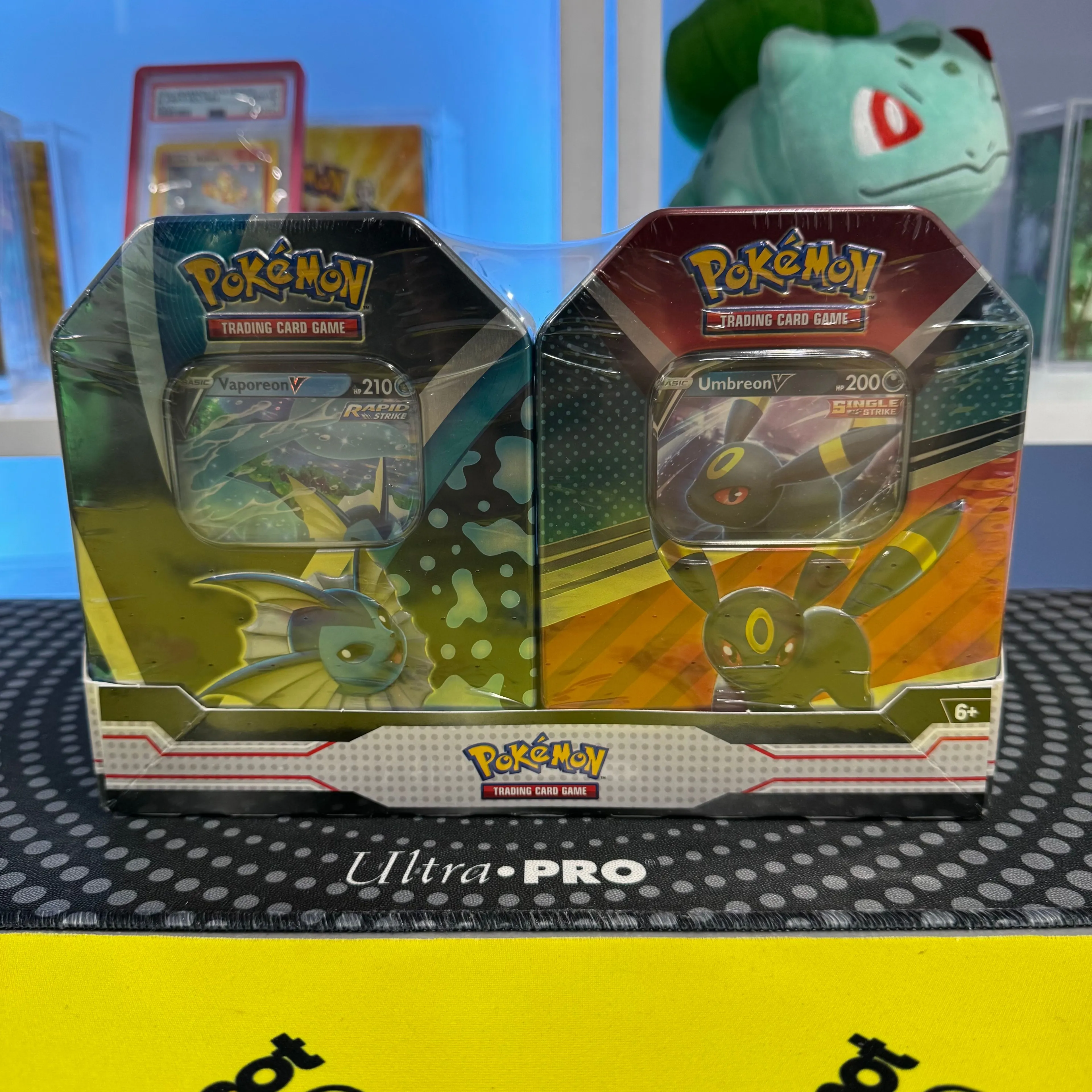 Eevee Evolutions Vaporeon V & V Heroes Umbreon V 2-Tin Bundle  Whatnot:  Shop, Sell, Connect