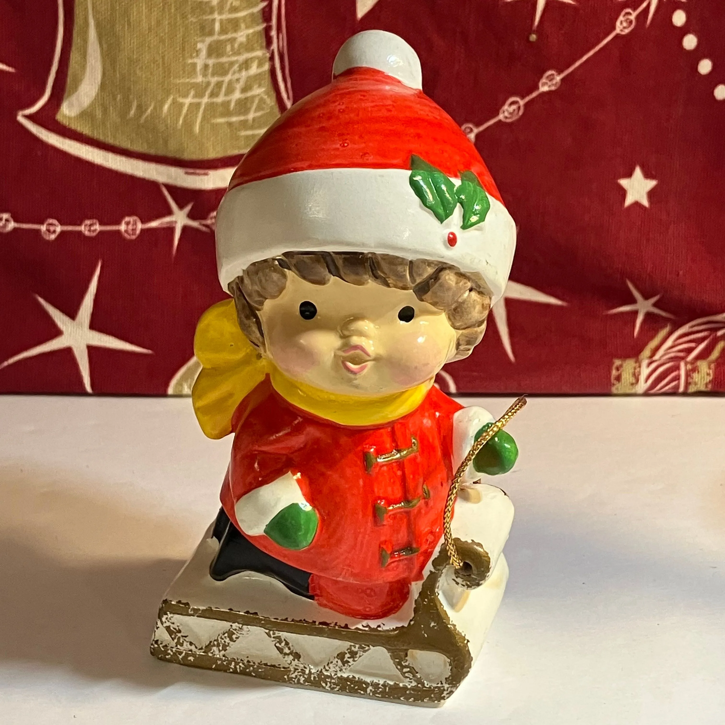 Product image for Vintage Christmas Figurine Child Sledding PO Holly Santa Hat Japan Kitsch
