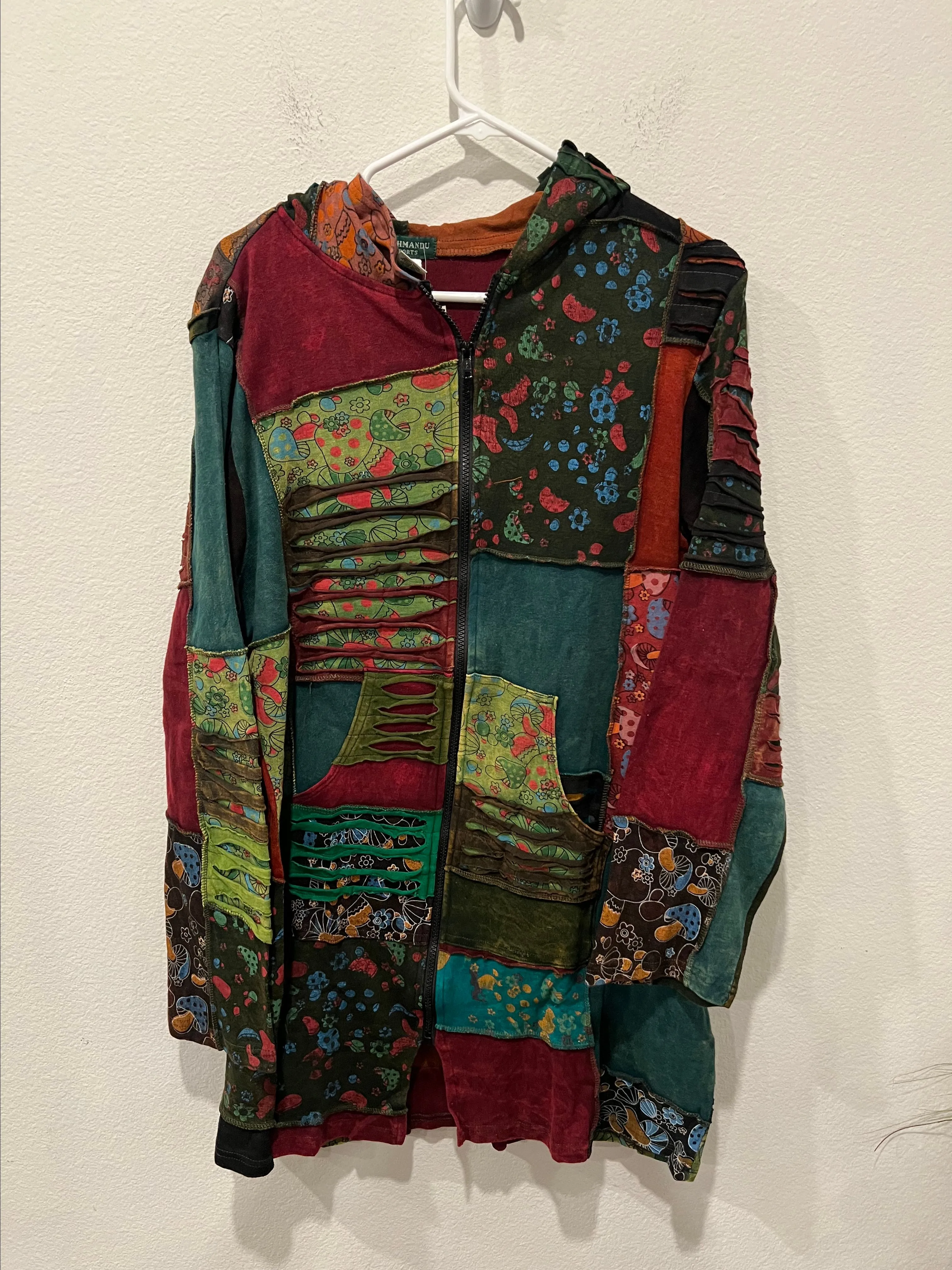 Product image for Colorful Patchwork Hooded Jacket by Kathmandu Size M/L