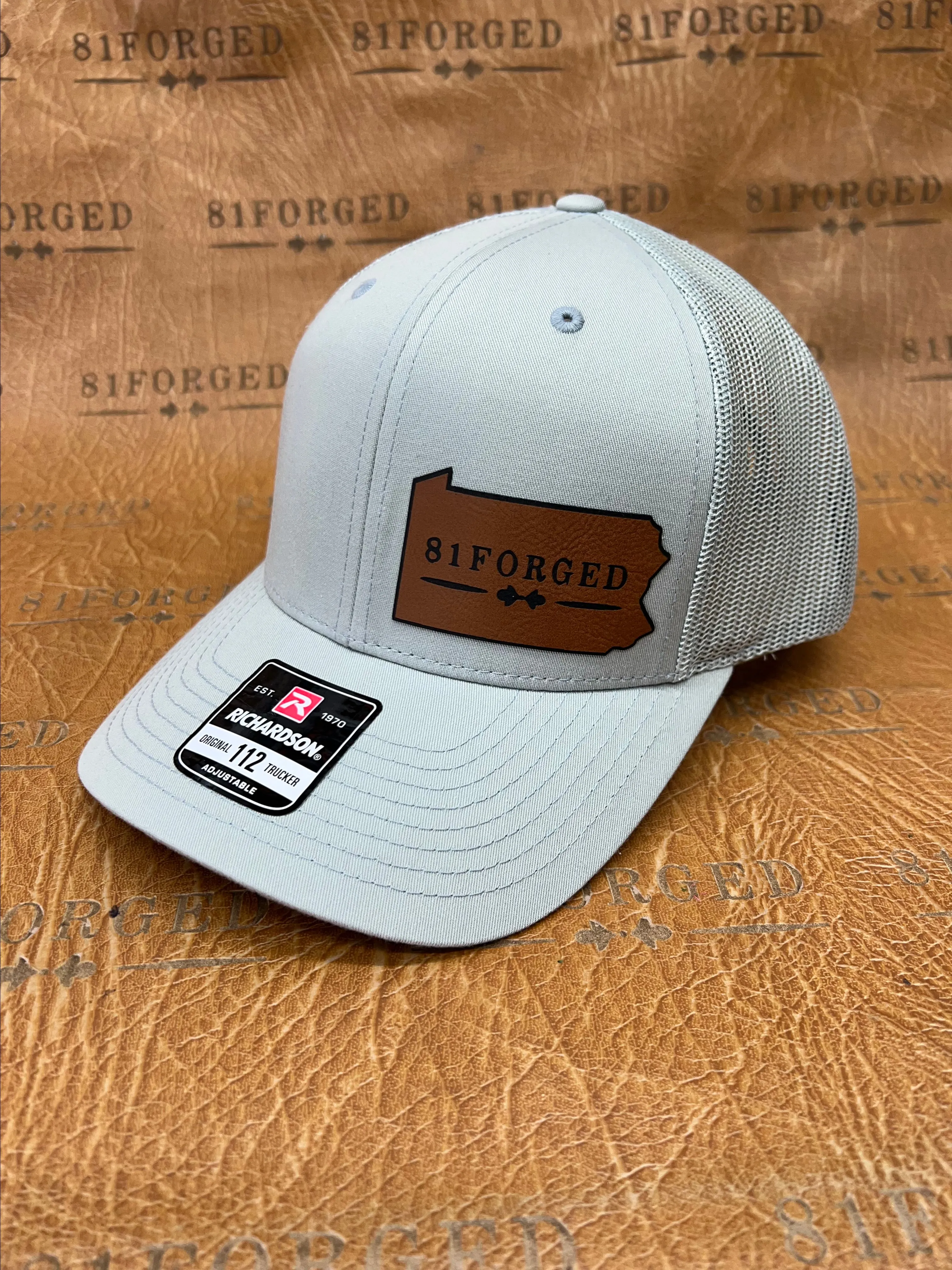 Product image for Richardson 112 leather patch hat with the 81Forged Logo.