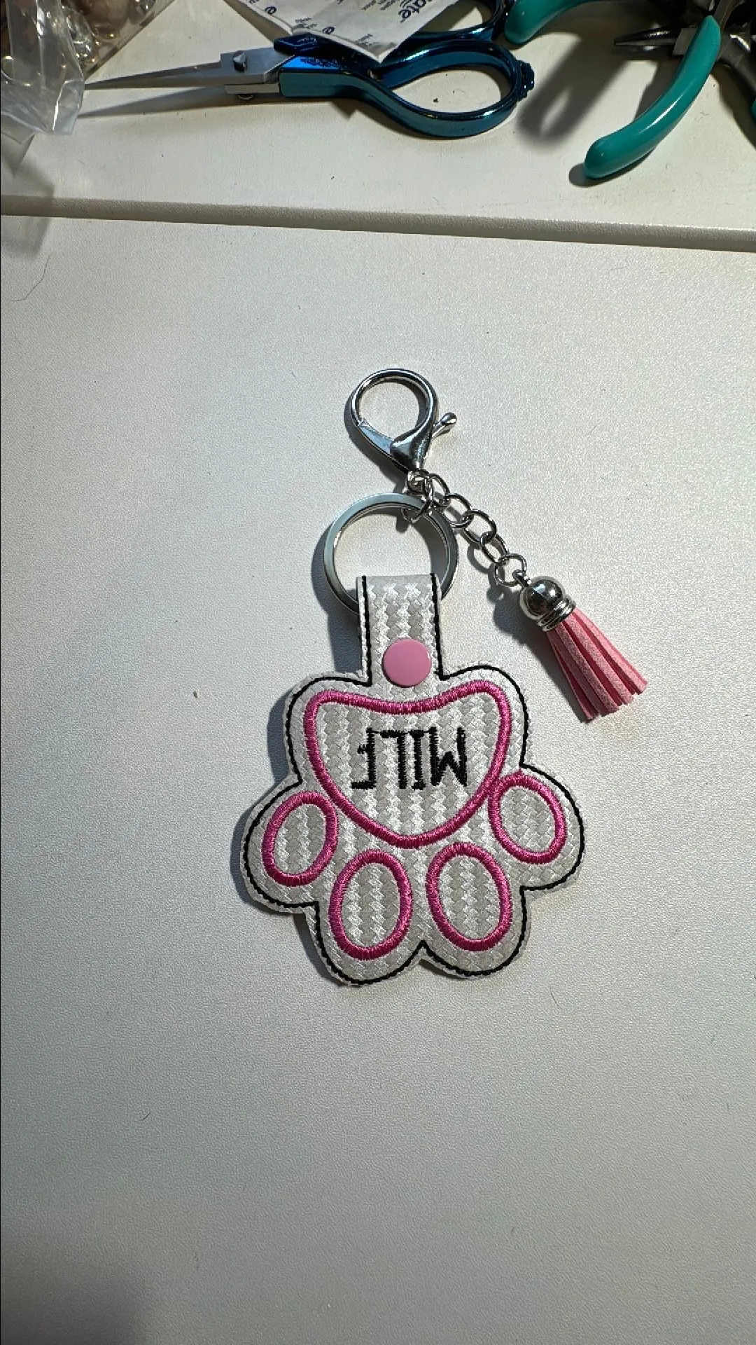 Product image for Paw print embroidered keychain without beads