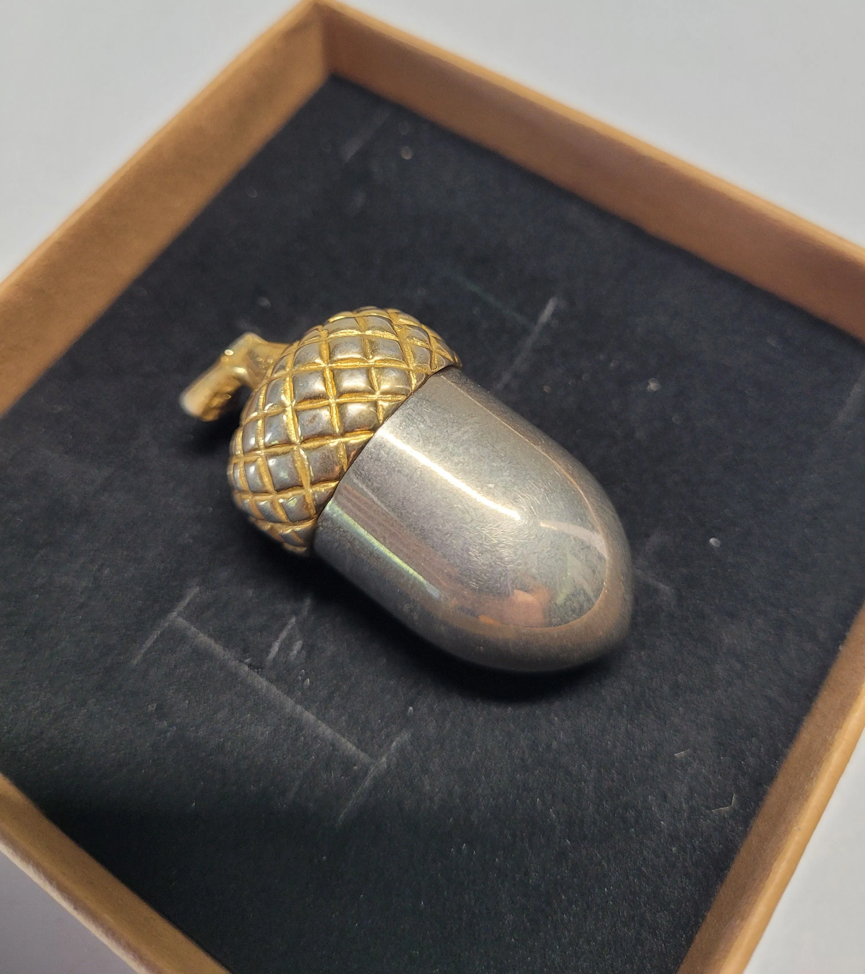 Product image for Vintage 2" Metal Acorn Pill Box Gold-toned Textured Cap & Silver-colored Base. The pill box is desig