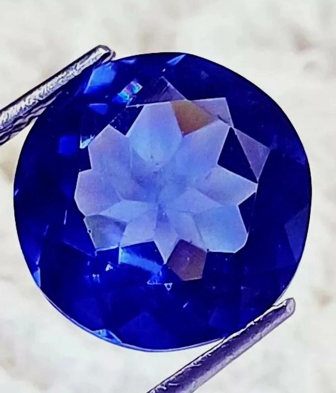 Product image for 9.10 Ct Loose Blue Zoisite Tanzanite-Like Excellent Round Cut Gemstone. The product is a 9.10 carat 