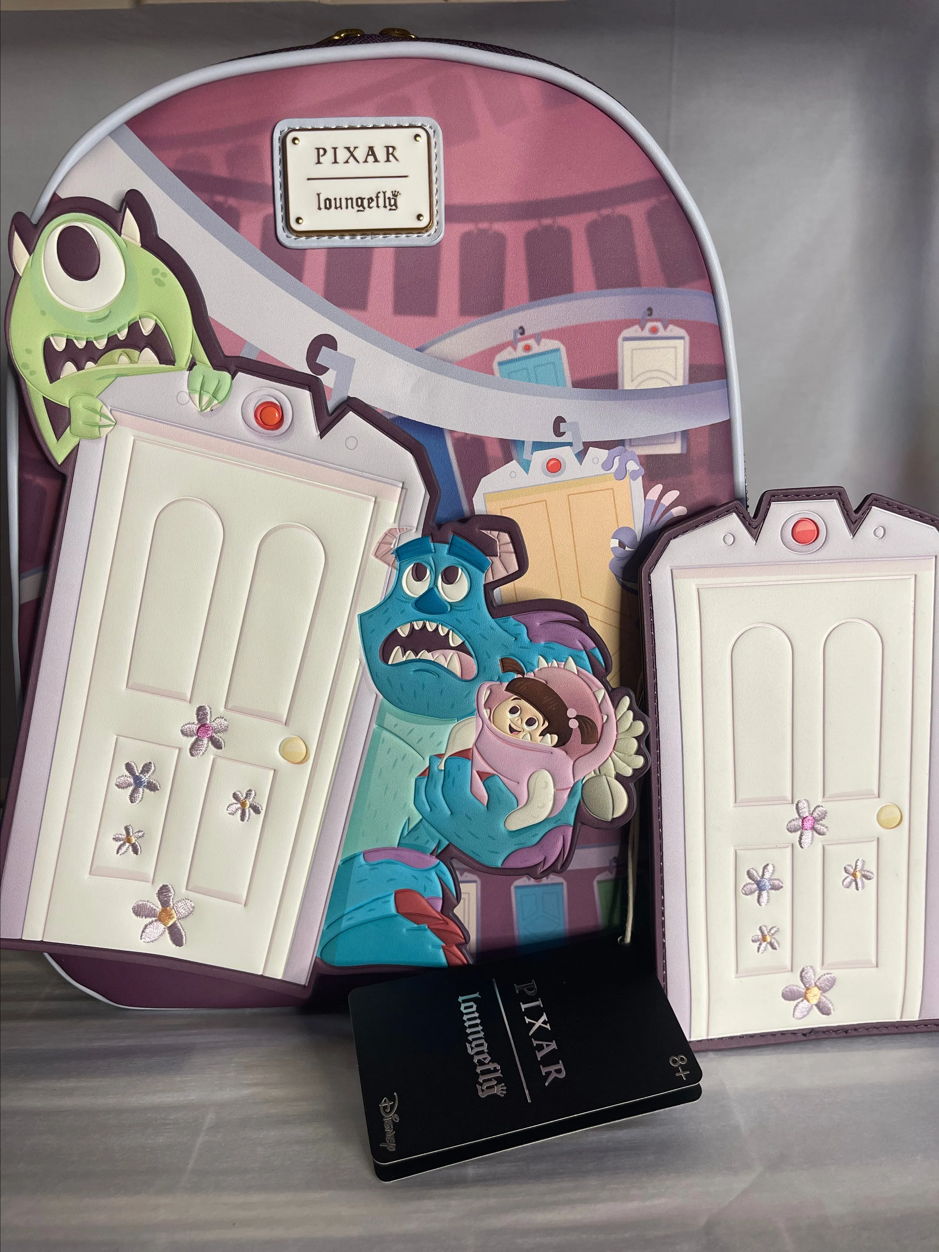 Product image for Loungefly Monsters Inc Door Backpack & Wallet