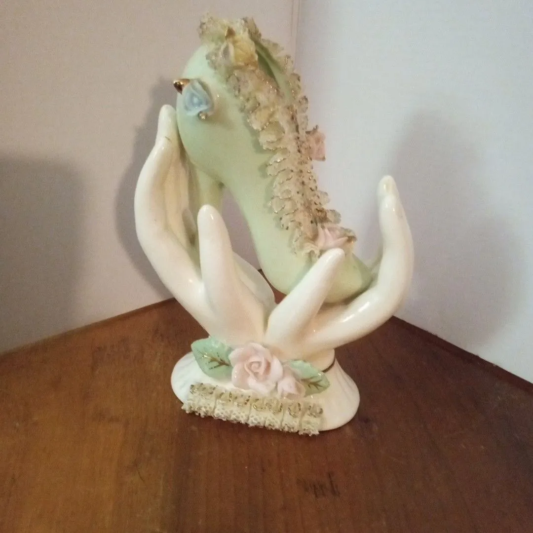 Product image for vintage porcelain shoe in Hand