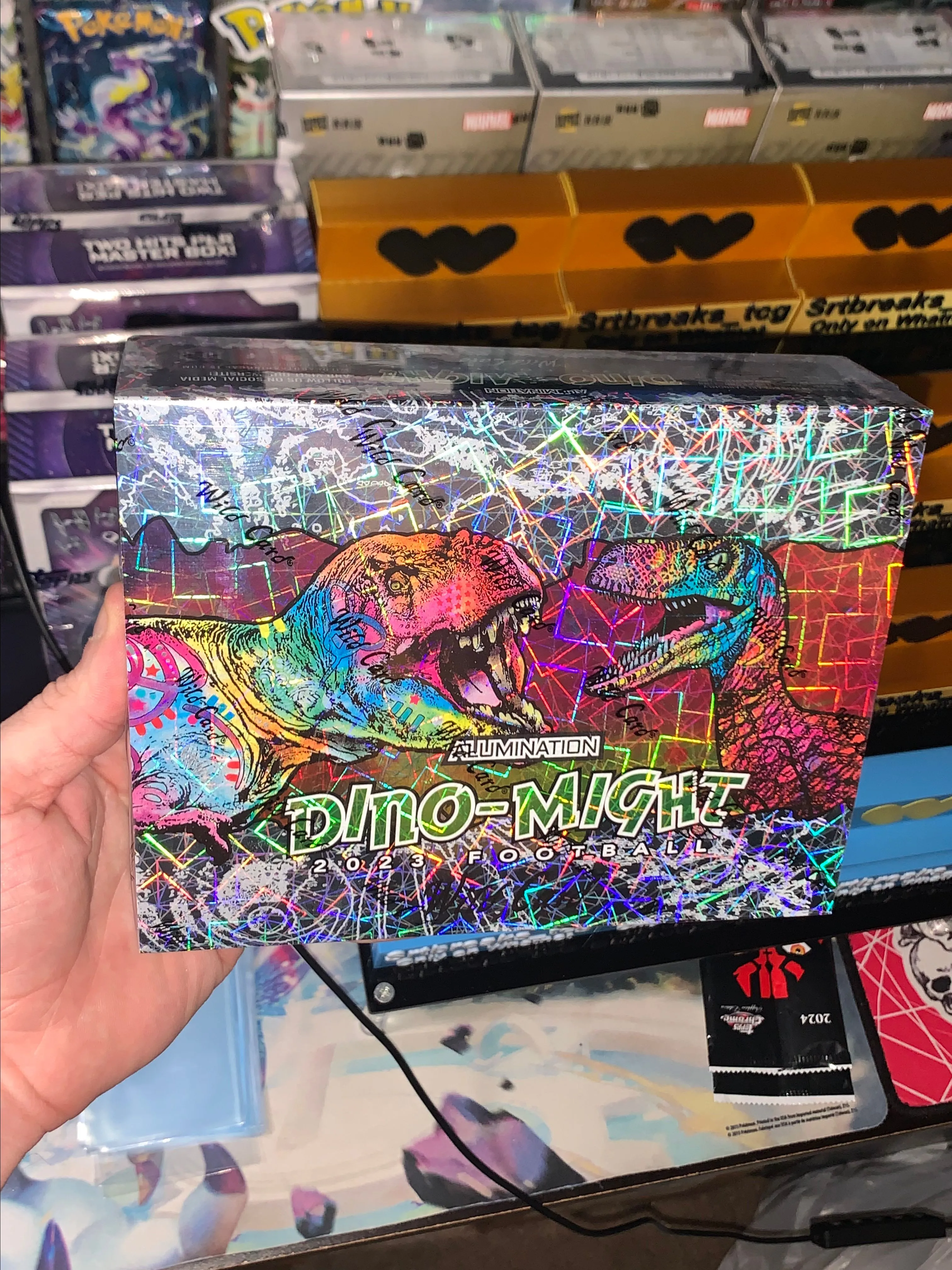 Product image for D1. Wild Card 2023 Football Dino Might full box (4 encased cards)