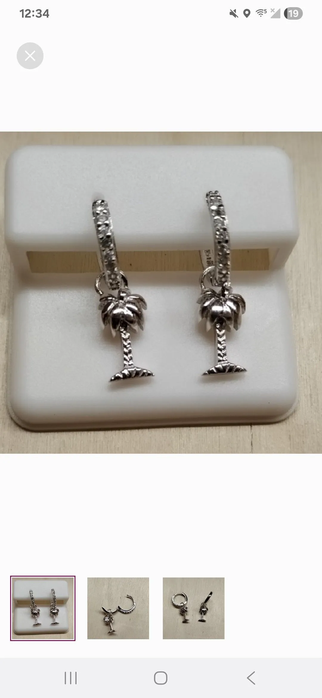 Product image for sterling silver palm tree huggie earrings 