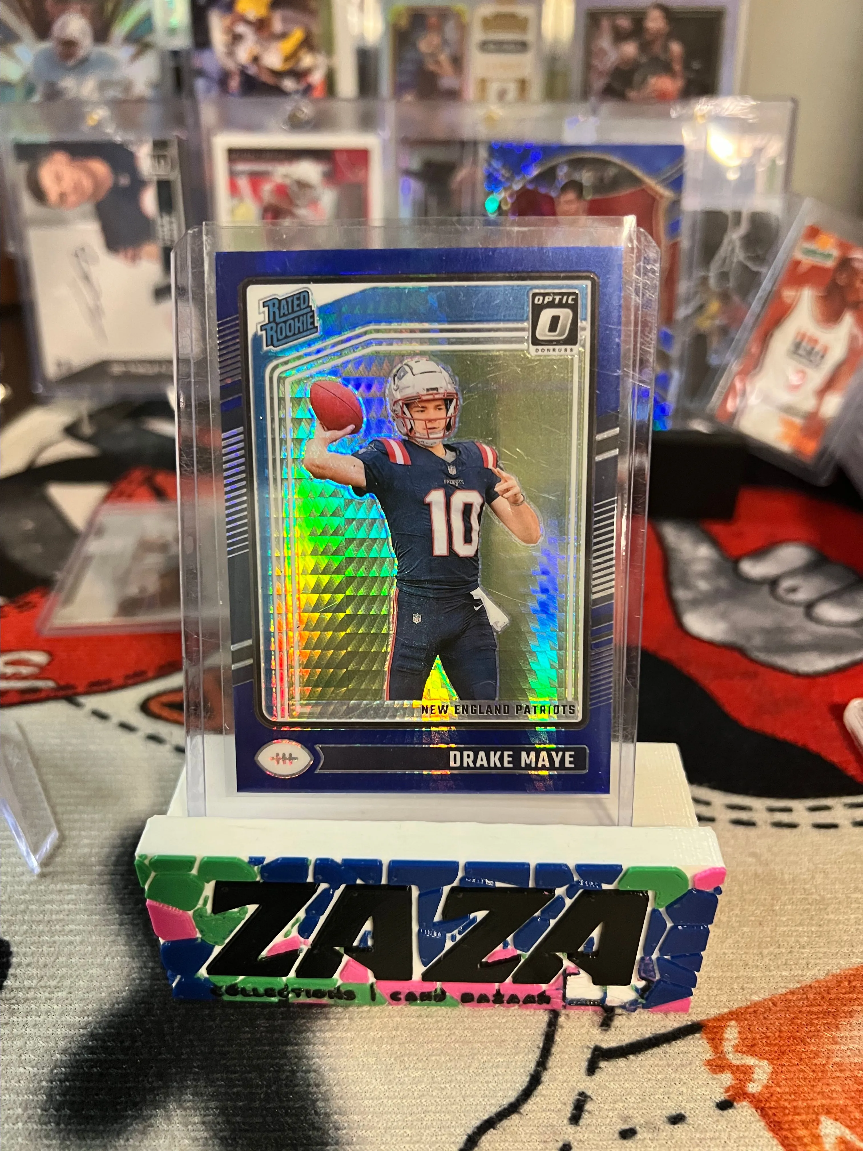 Product image for 2024 Panini Optic Rated Rookie Drake Maye Blue Hyper Prizm RC!