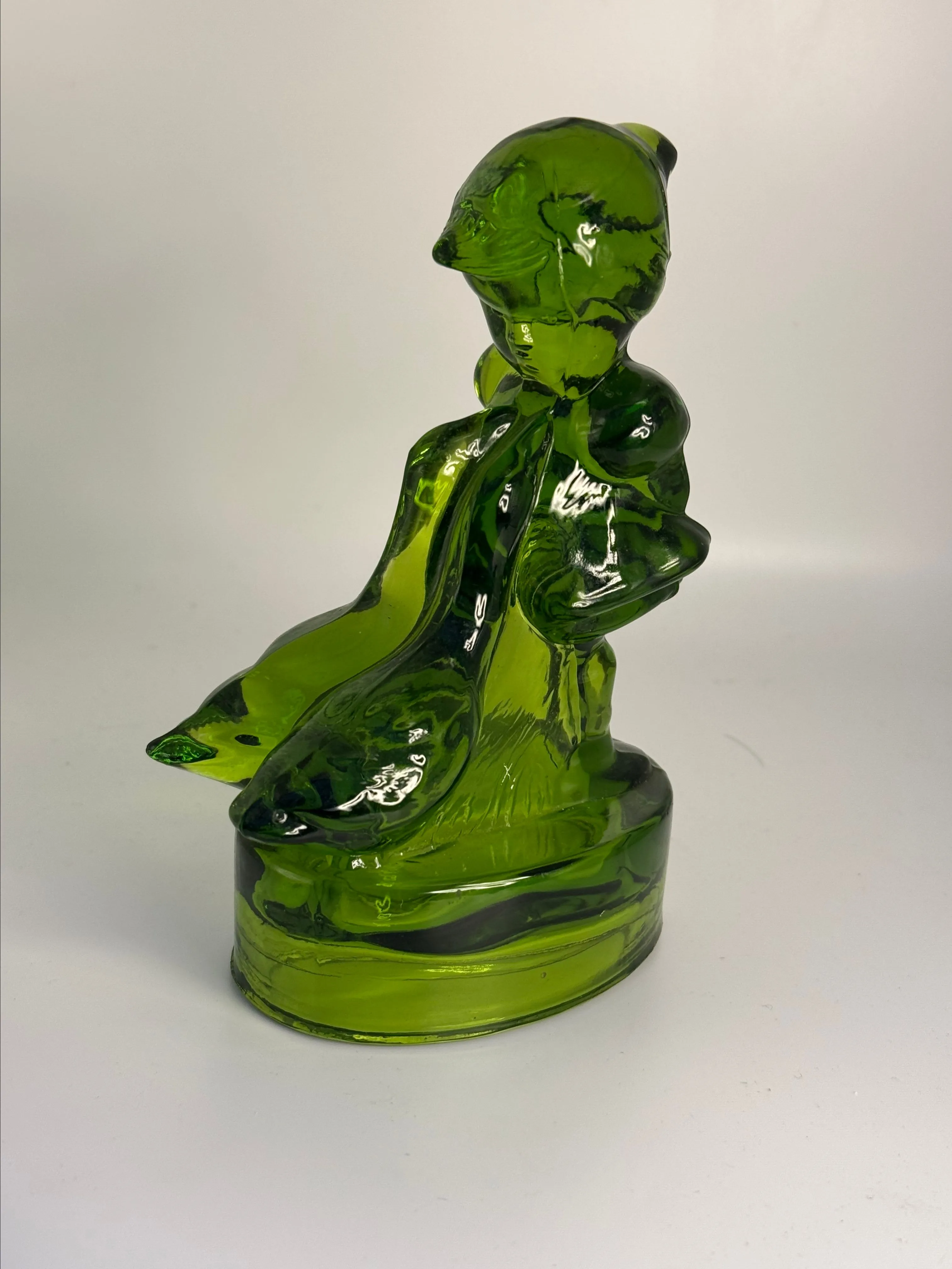 Product image for vintage L.E. Smith green glass figurine, known as "Girl with Geese" or "Goose Girl.