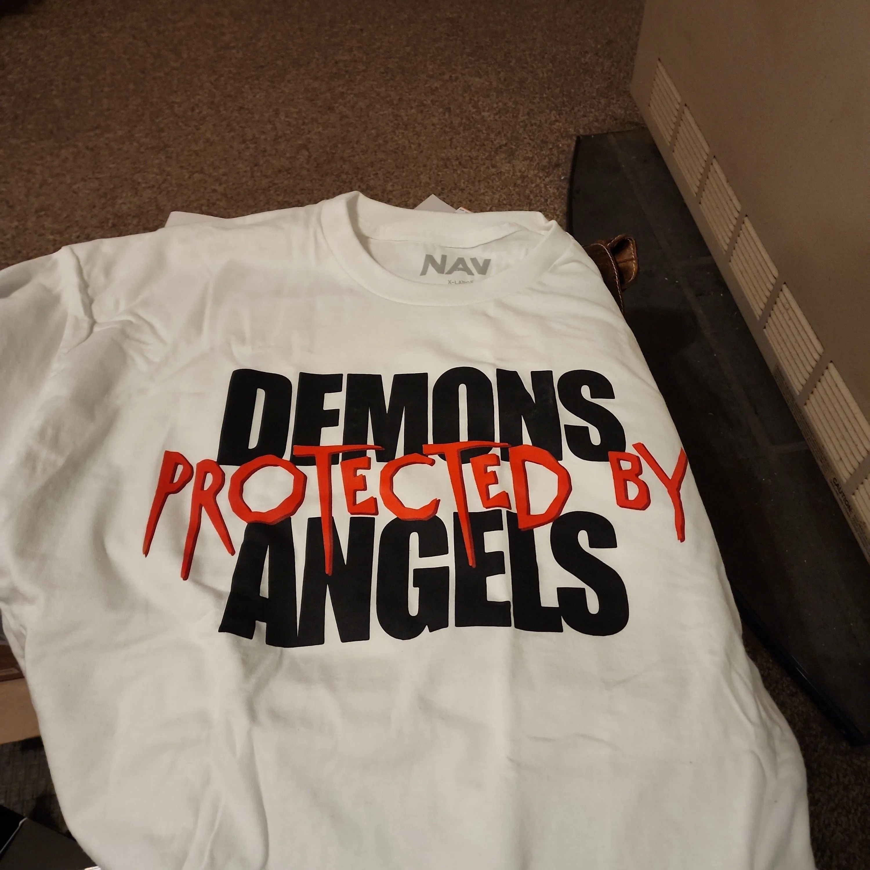 Product image for mens xl shirt  and comes with cd demons protected by angels