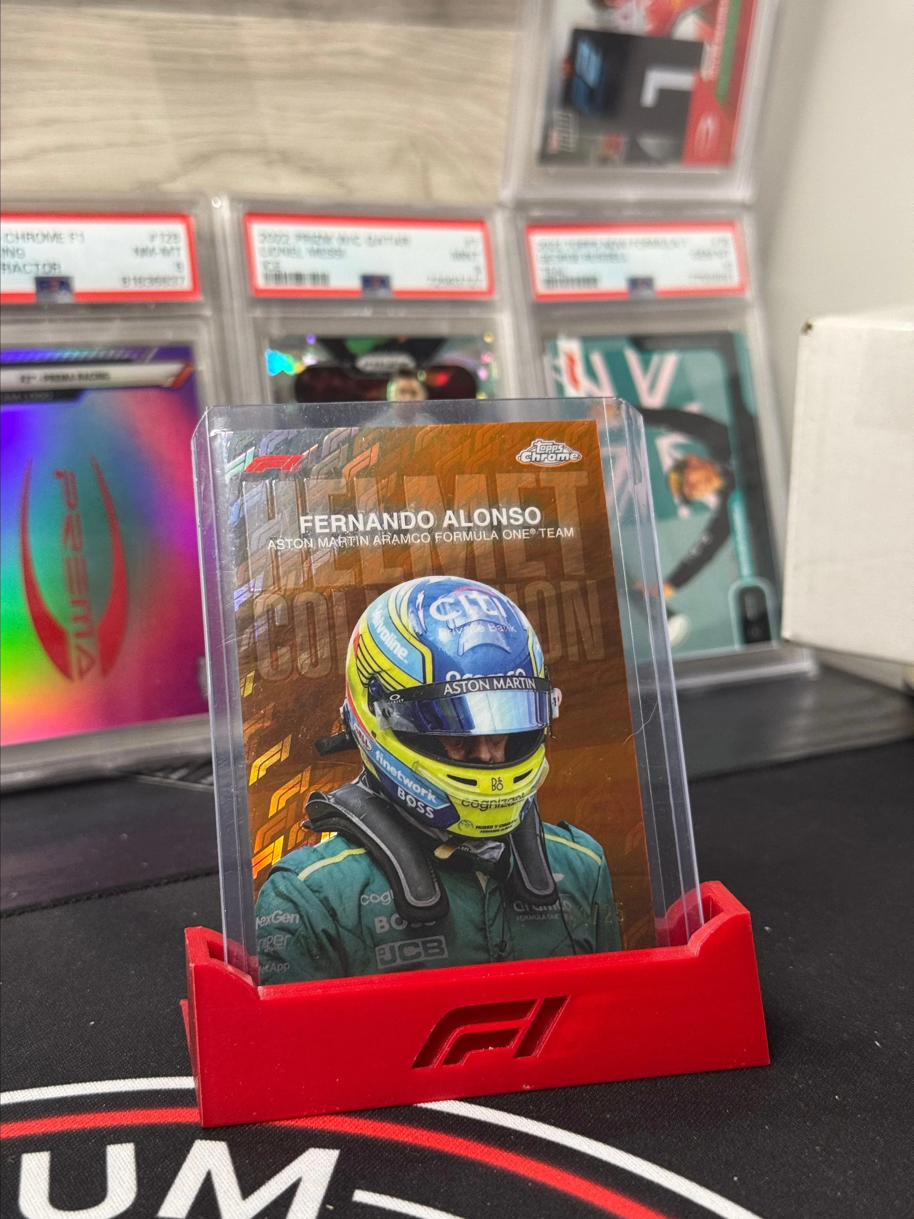 Product image for 2024 Topps Chrome Formula 1 Logofractor - Fernando Alonso Orange Helmet /25