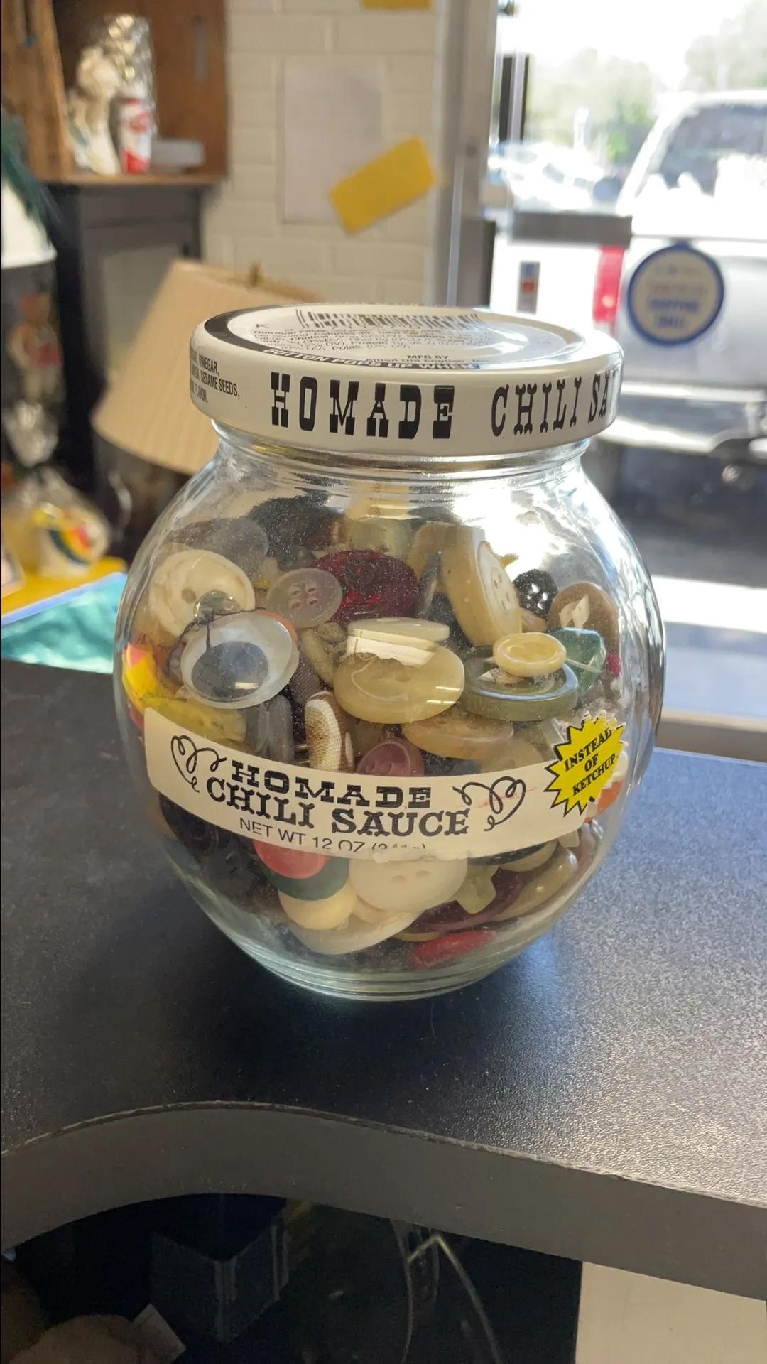 Product image for Button in chili jar