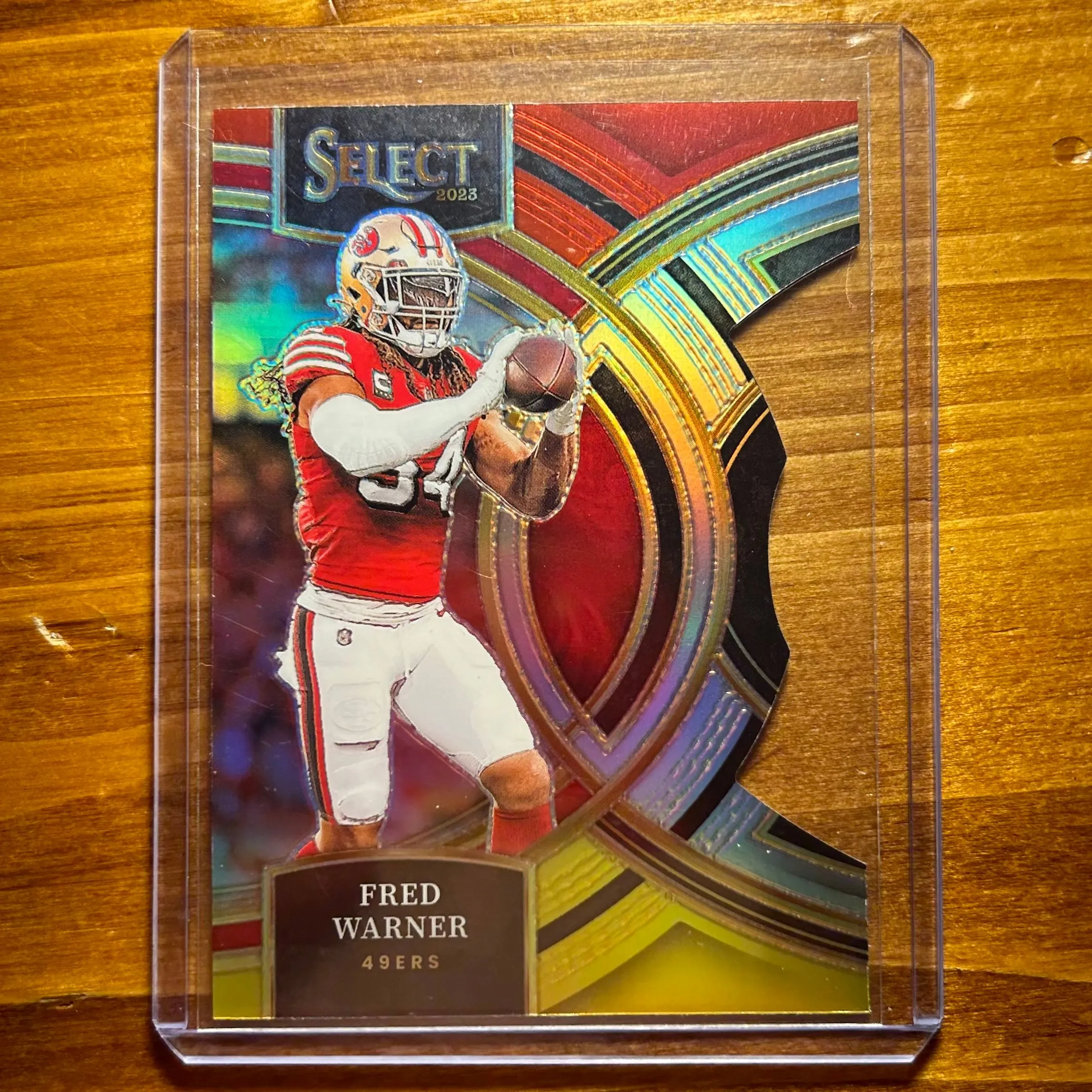 Product image for Fred Warner - 2023 Panini Select Die-Cut inRed & Yellow Prizm Premier Level #195 - San Francisco 49e