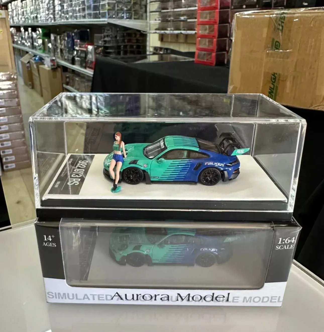Product image for PORSCHE 992 GT3 RS FALKEN WITH FIGURE 1/64 SCALE DIECAST CAR MODEL BY AURORA