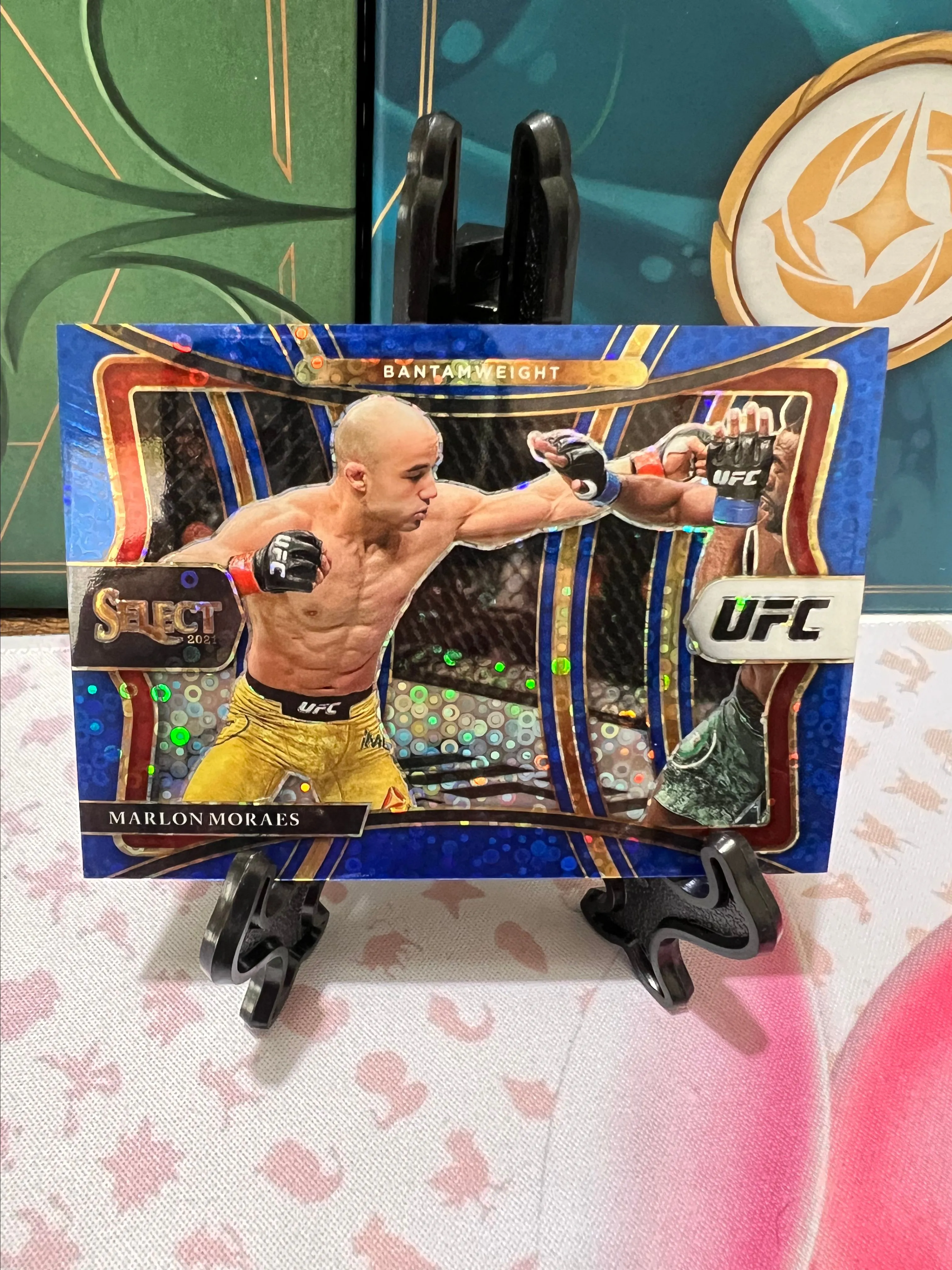 Product image for 2021 Panini Select UFC Premier Level Blue Disco Prizm /99 Marlon Moraes #166