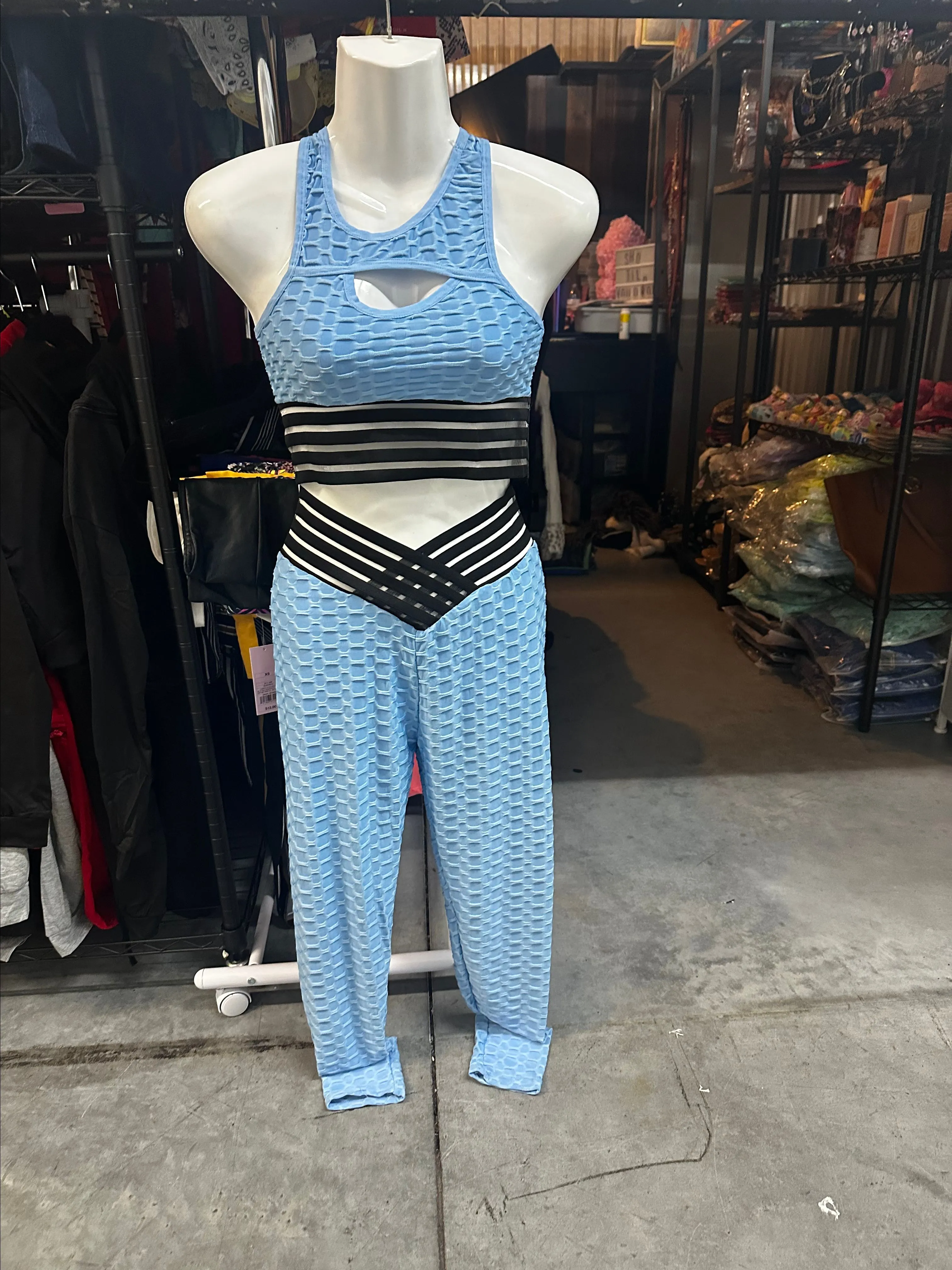 Product image for blue textured gym set with black stripe accents. New Size L/XL