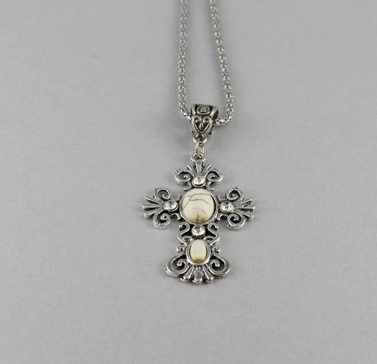 Product image for 0004  Scrolled Southwestern Rhinestone Howlite Cab Cross Silver Tone Necklace