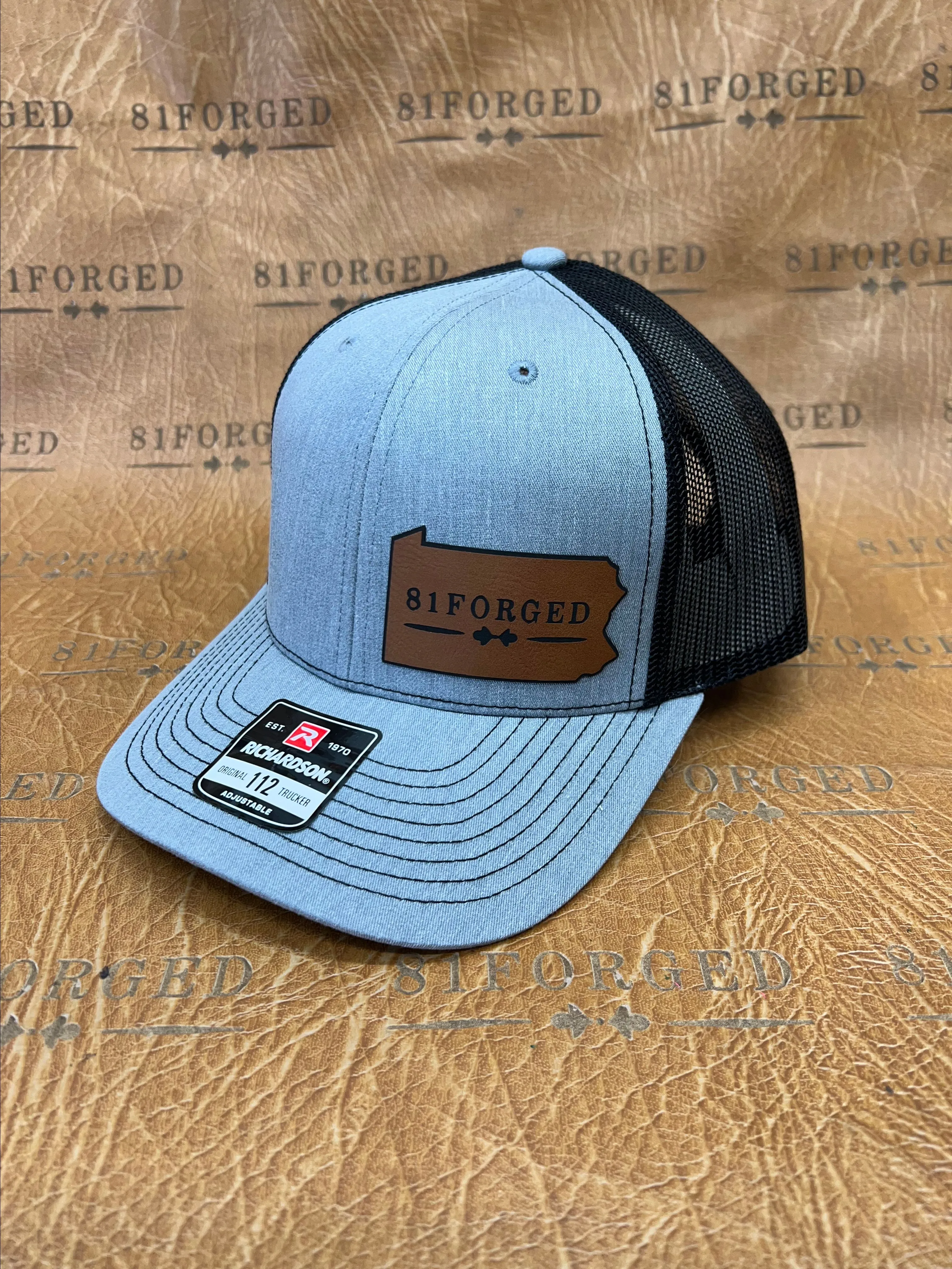 Product image for Gray Richardson 112 leather patch hat with the 81Forged Logo.