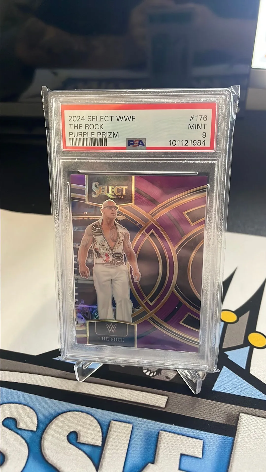 Product image for 2024 Select WWE - The Rock - Purple Prizm /99 PSA 9