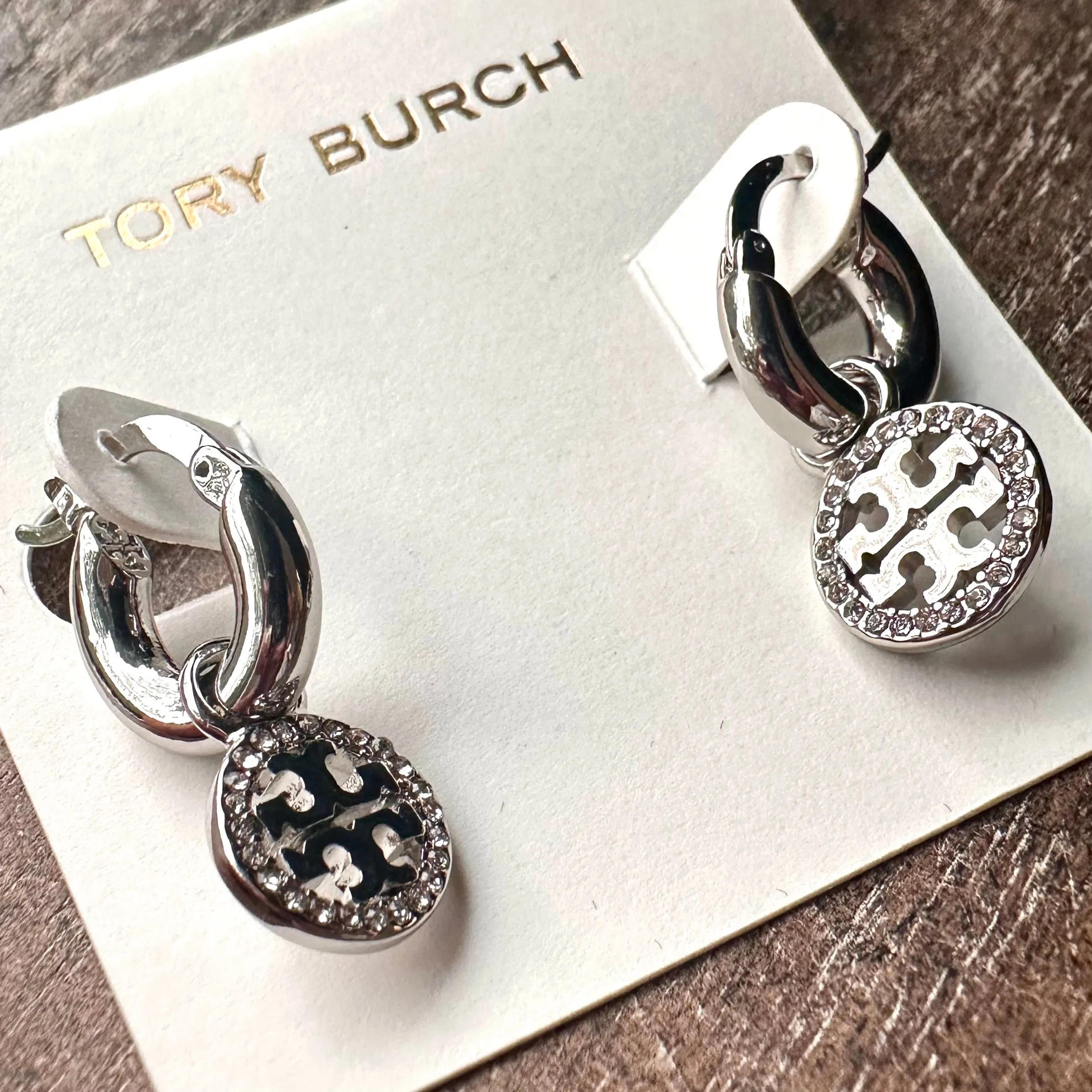 Product image for New Tory Burch silver Miller pavé huggie hoop earrings; Silver. Comes on TB card