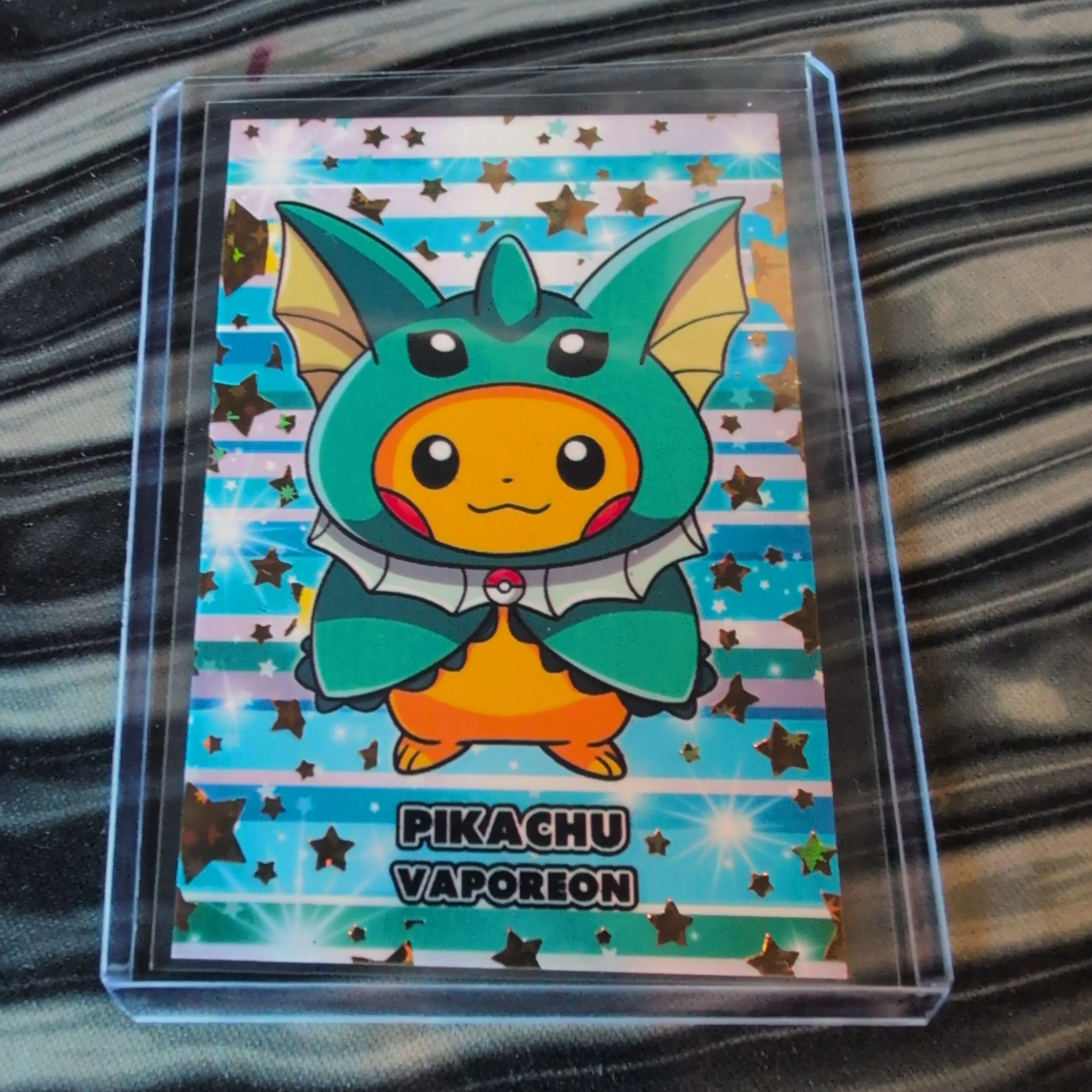 Product image for GOLD STAR HOLO Pikachu poncho Vaporeon