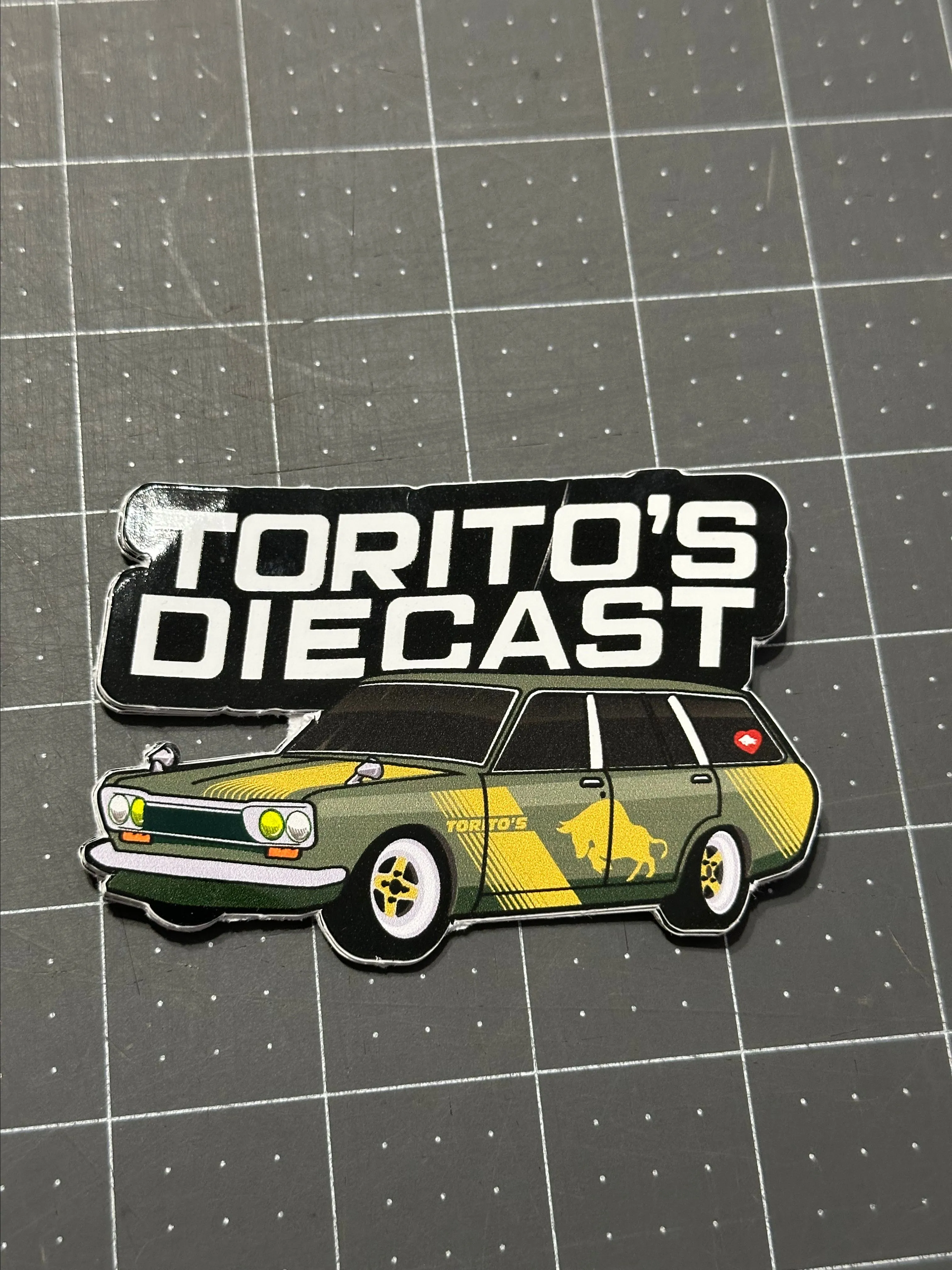 Product image for Datsun 510 wagon. Green torito diecast sticker.