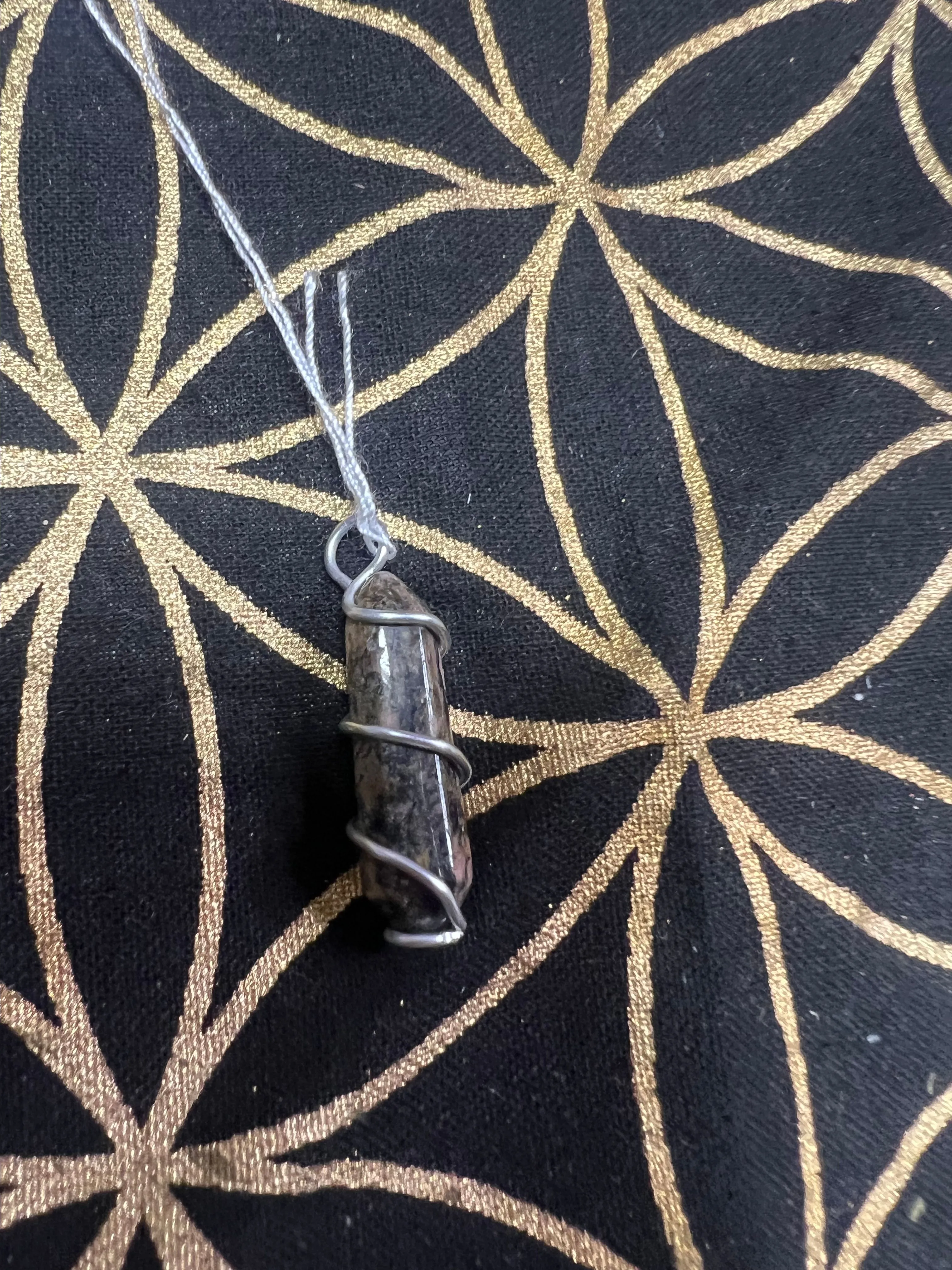 Product image for Rhodonite point wrapped