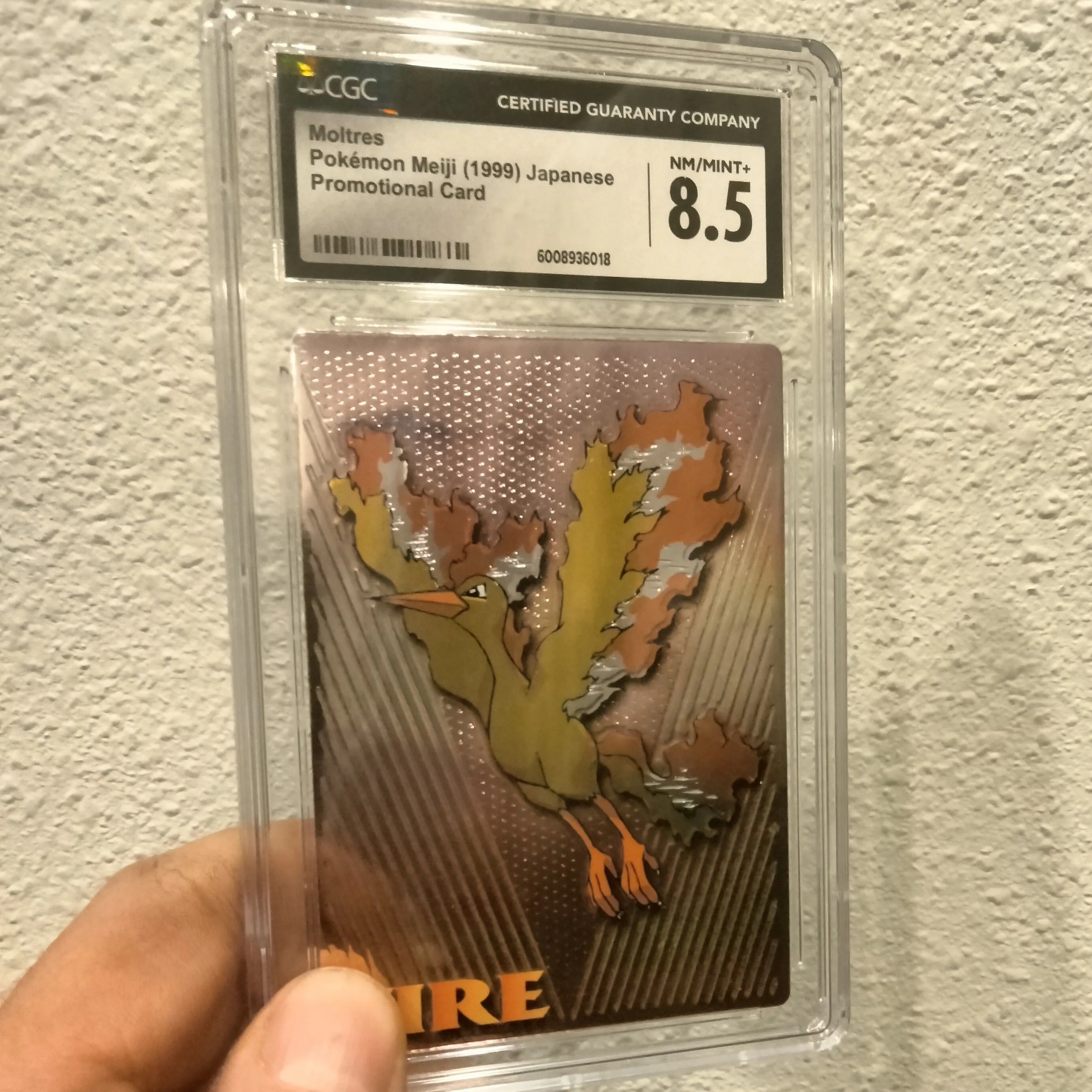 Product image for CGC 8.5 nm/mint+ 1999 Japanese Pokemon Meiji Fire Moltres Promo Embossed Card