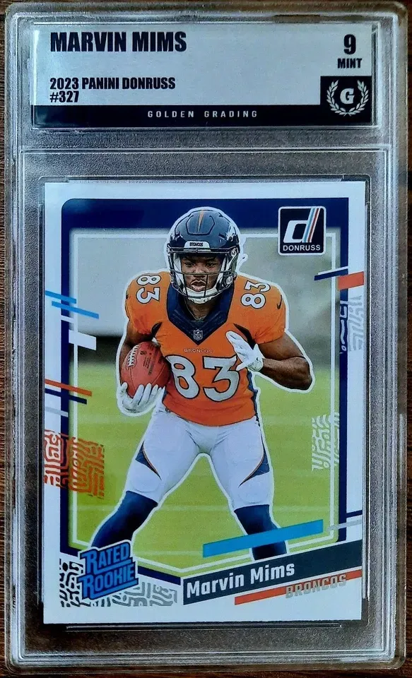 Product image for Marvin Mims 2023 Panini Donruss Rated Rookie RC #327 Golden Grading (GG) 9 Mint