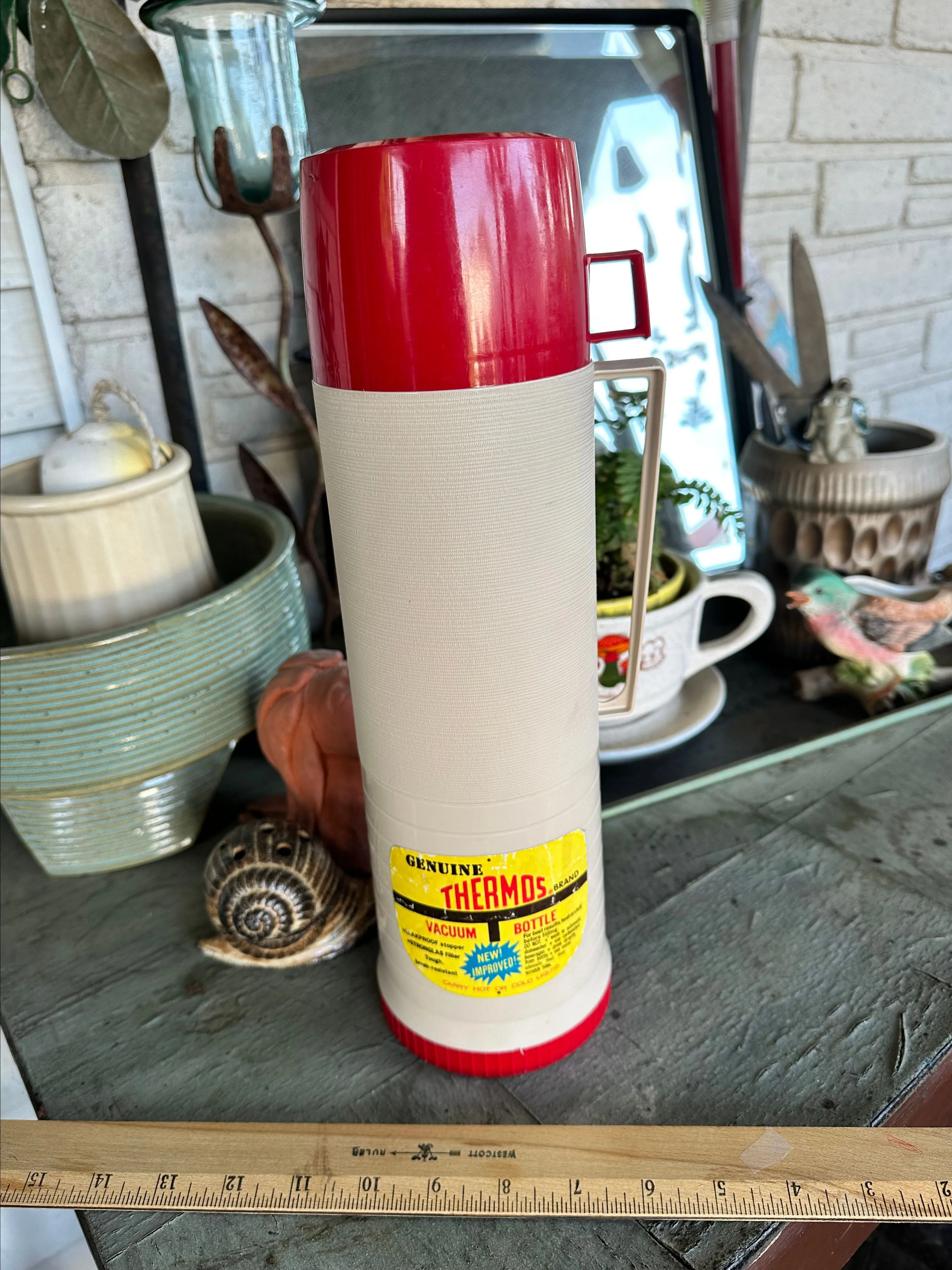Product image for Tall plastic red and white thermos with sticker